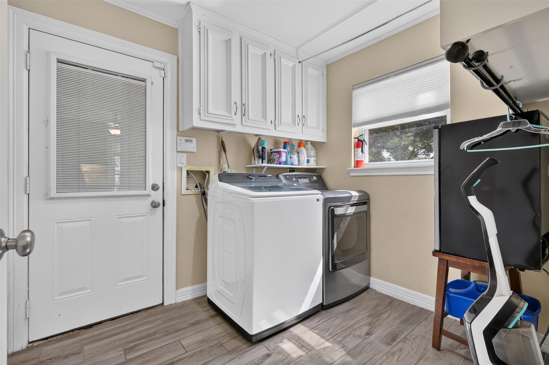 Utility off kitchen with entry to garage