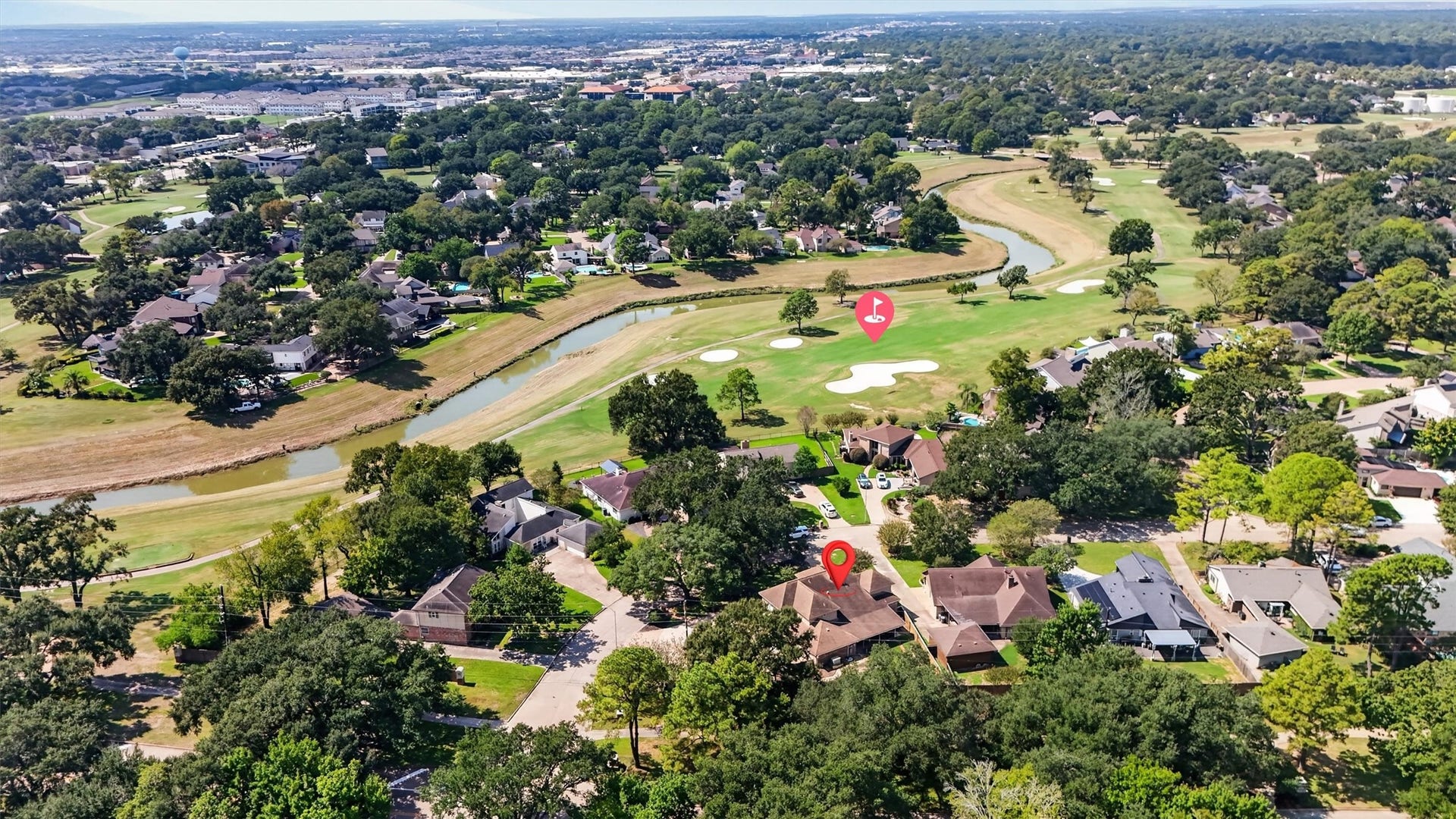Aerial view showing house in reference to golf course