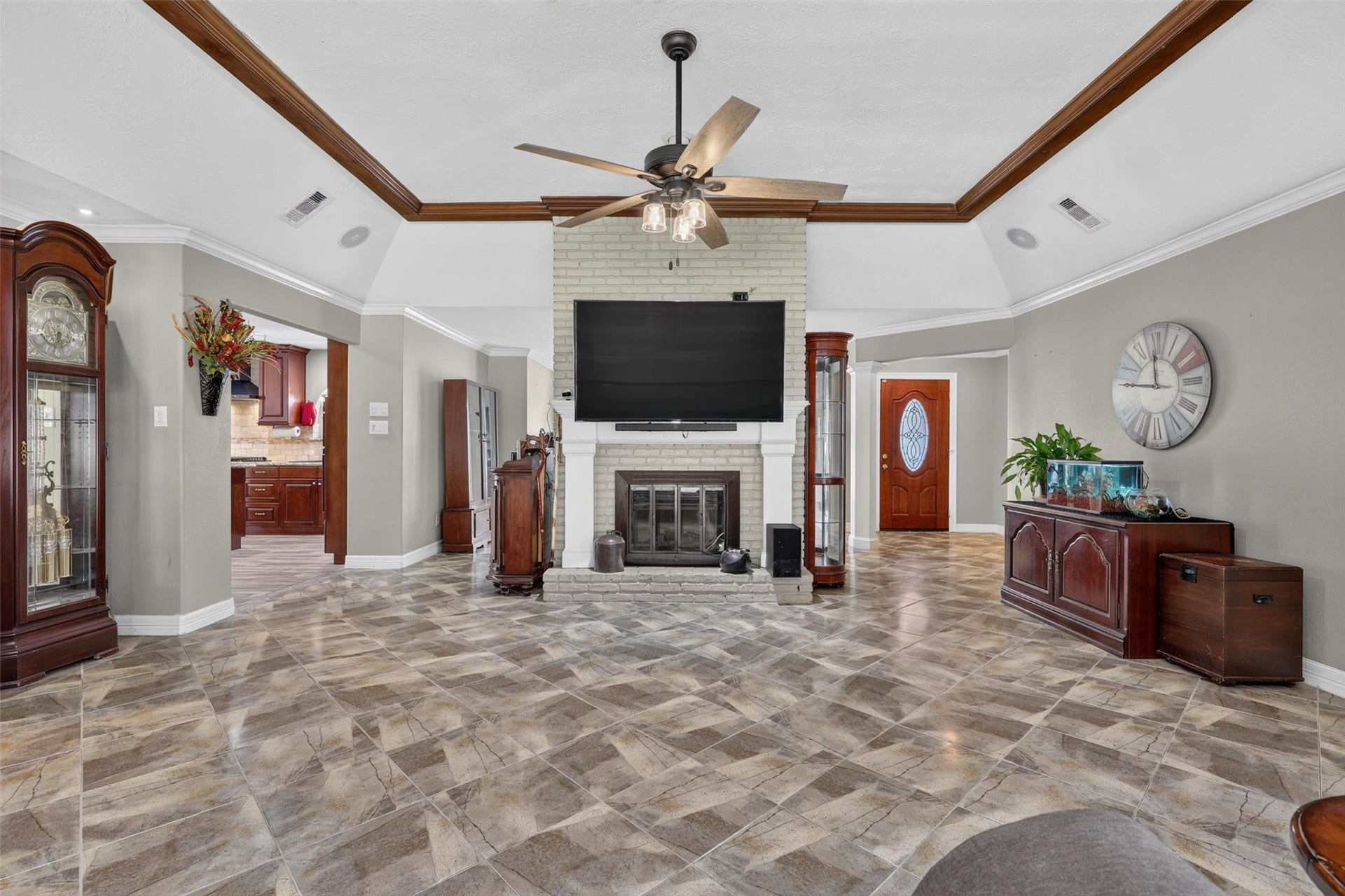 Another view of family room showing fireplace and kitchen doorway
