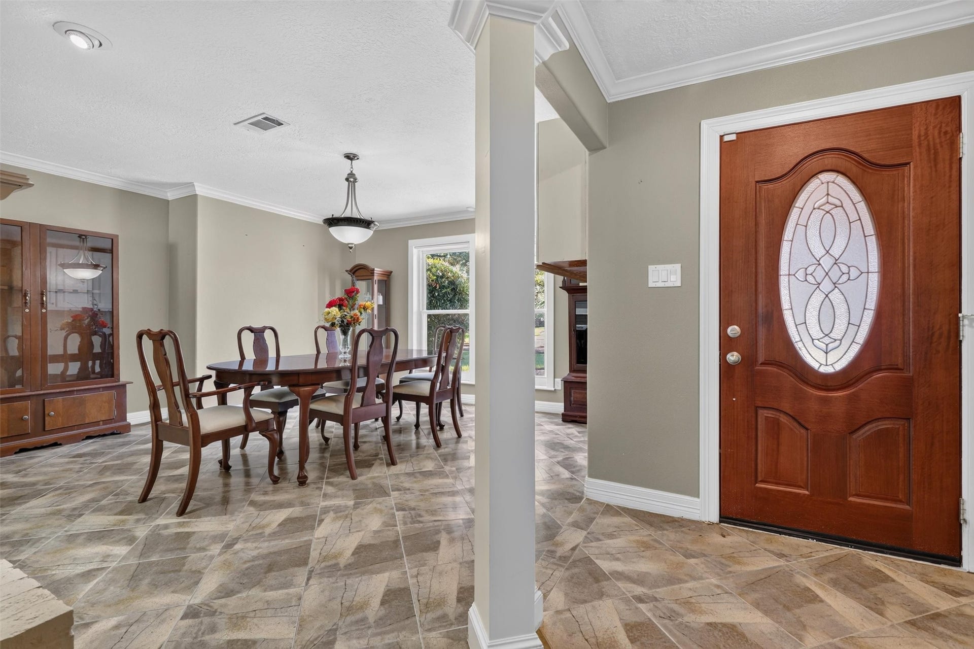 Entry foyer to open formal dining room