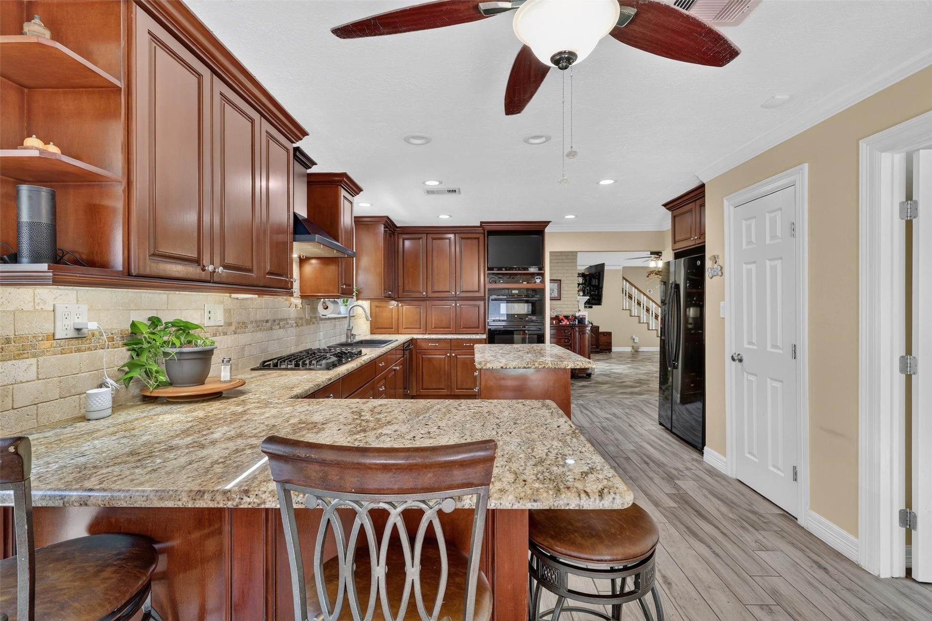 View of kitchen with door to walk in pantry