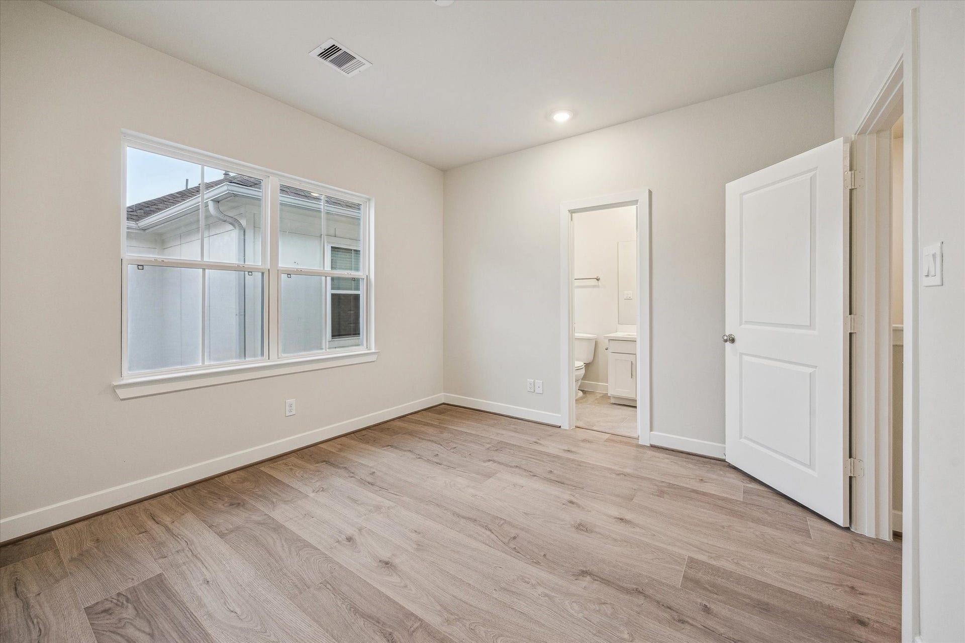 Representative photo showing the communitys model home secondary bedroom. Layout and selections may vary.