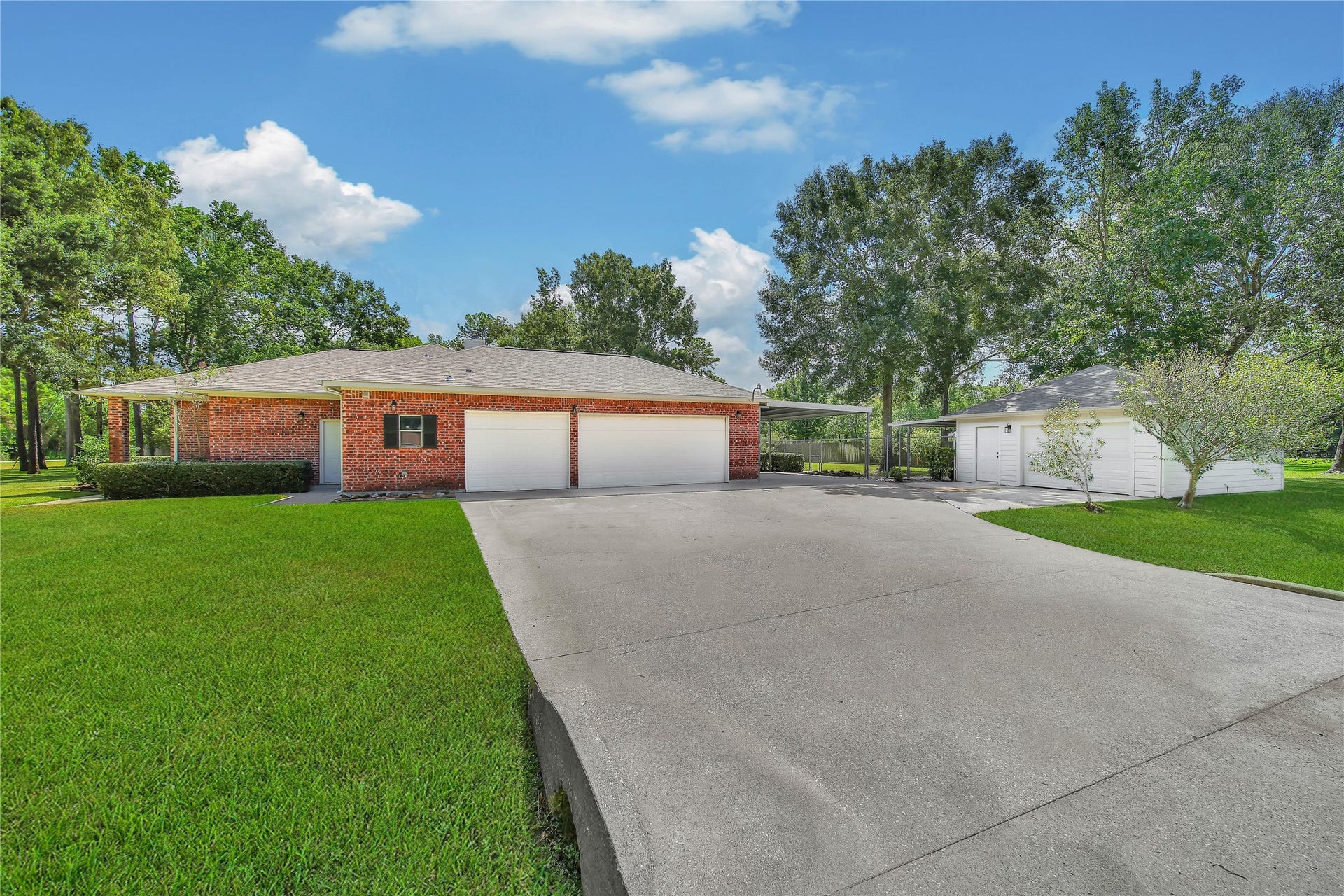 1125 W Stroker Road, #1125, Crosby, TX 77532 3 car garage attached to the house, a separate detached garage, and a carport!