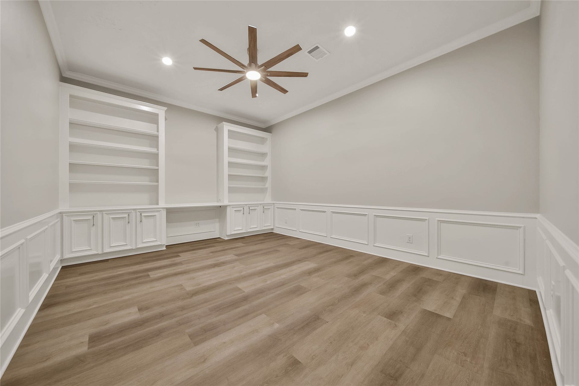 1125 W Stroker Road, #1125, Crosby, TX 77532 Huge office with custom built ins and banker paneling off of the living room.