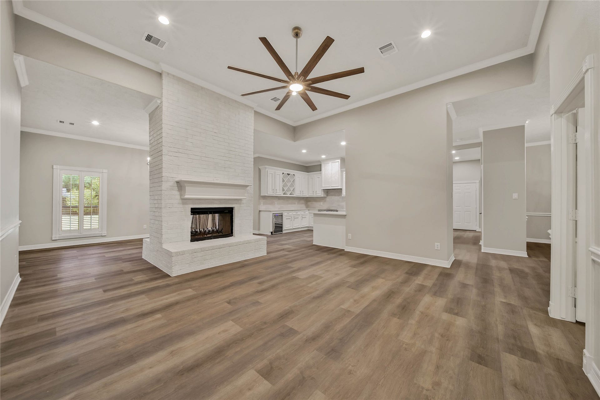 1125 W Stroker Road, #1125, Crosby, TX 77532 Double sided fireplace in living area with high ceilings.