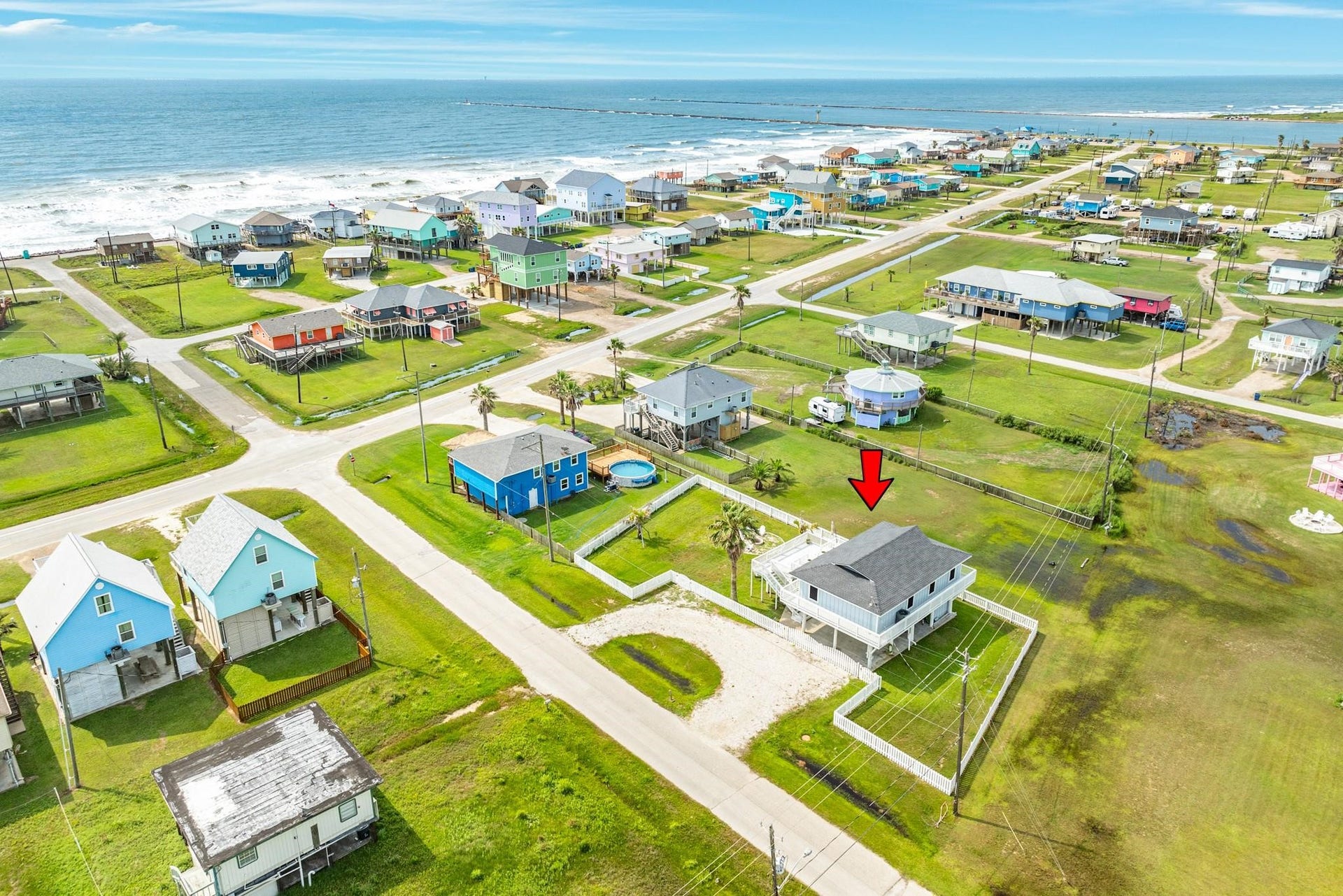 307 Angel Wing Street, Surfside Beach, TX 77541 Circular driveway with lots of space for parking this fully fenced lot is spacious for all your needs.