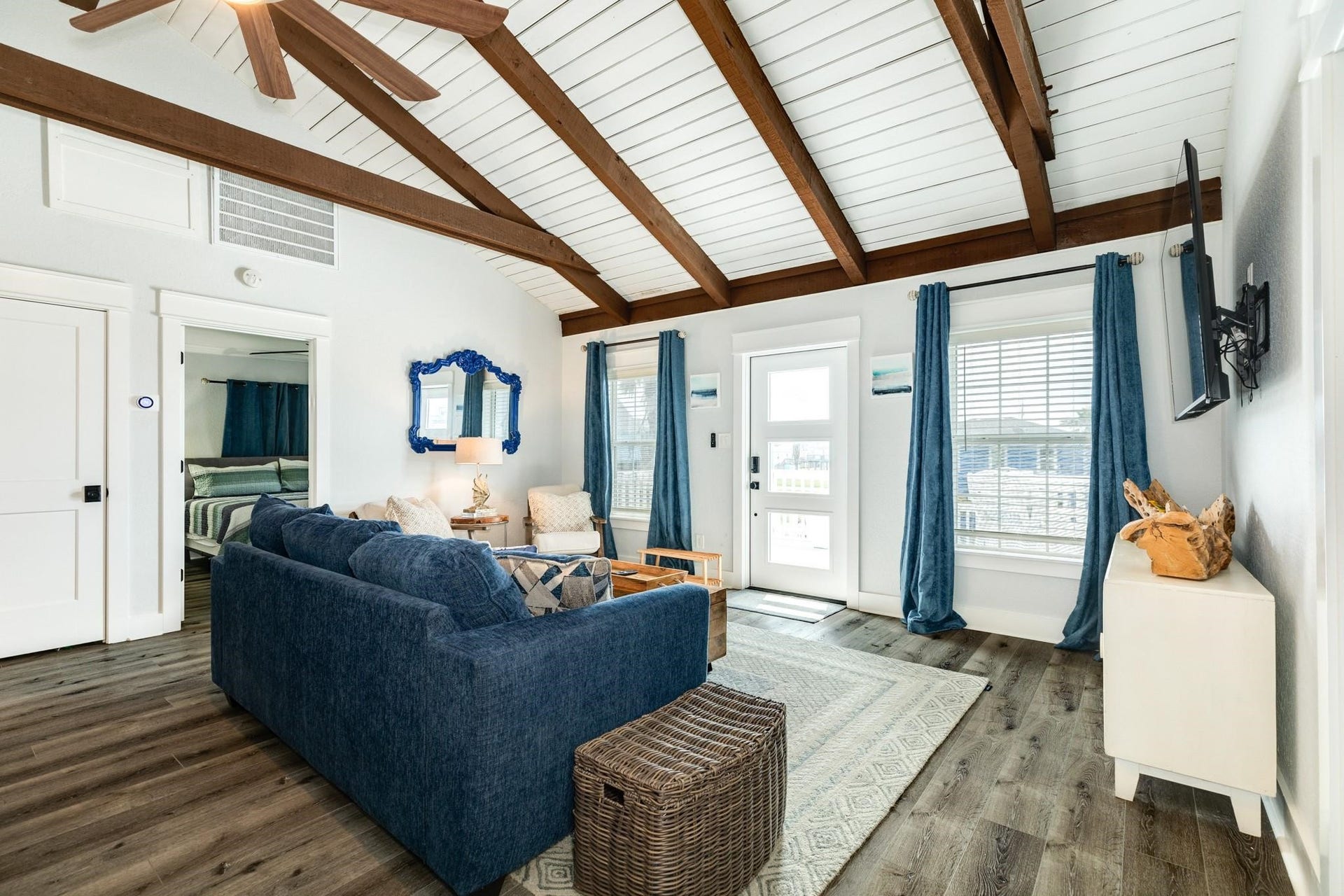 307 Angel Wing Street, Surfside Beach, TX 77541 Featuring beautiful wood beams, comfortable furnishings, and a warm coastal feel, this inviting family room is the perfect place to relax, reconnect, and make lasting memories.