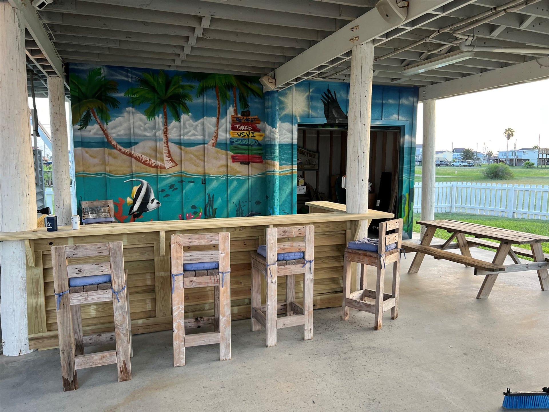 307 Angel Wing Street, Surfside Beach, TX 77541 The party starts here! Custom built bar with vibrant beach-inspired mural is the perfect place to unwind!
