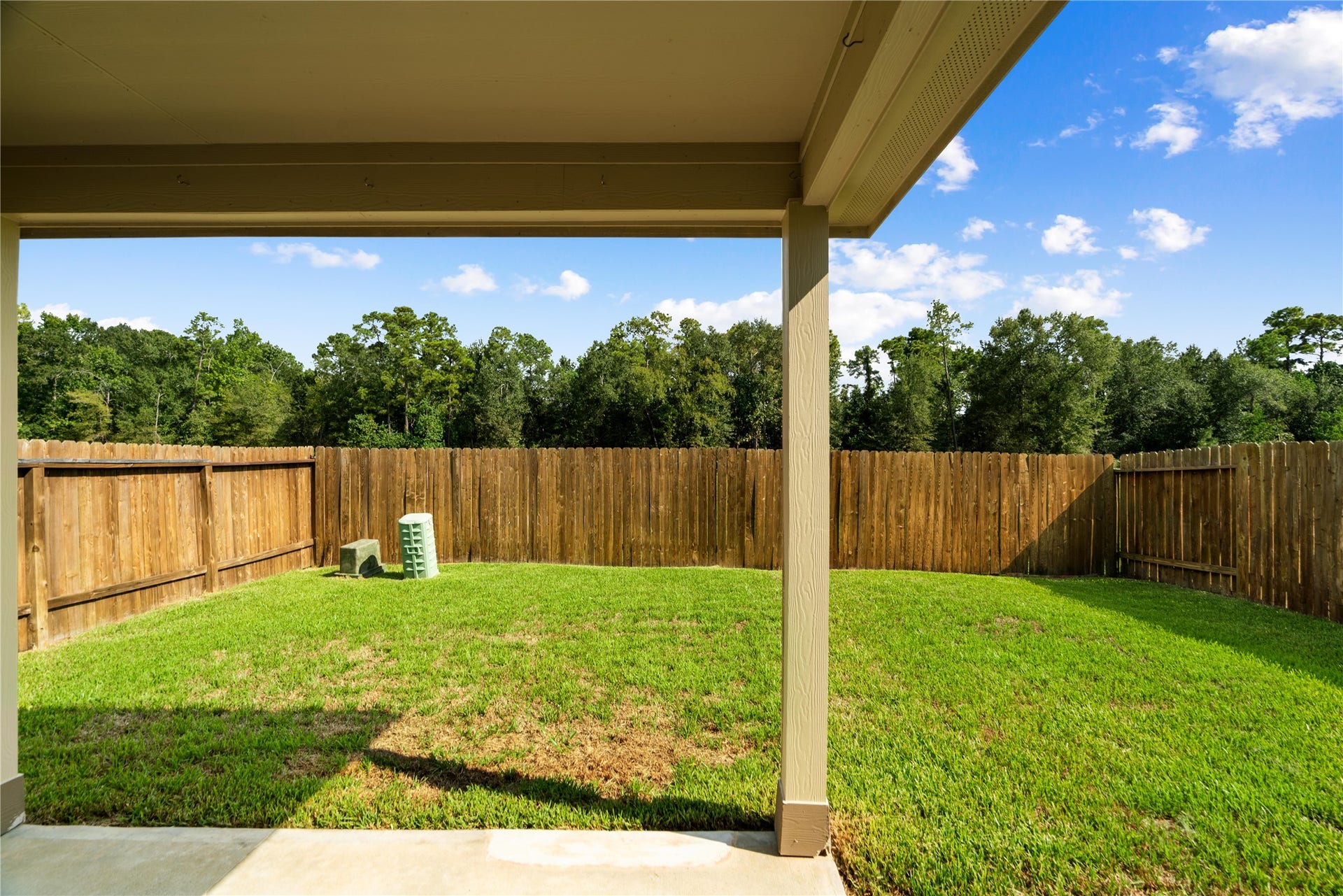 Enjoy added privacy with no back neighbors and a beautiful tree-lined backdrop. The fenced backyard and covered patio create a peaceful outdoor space for relaxing.