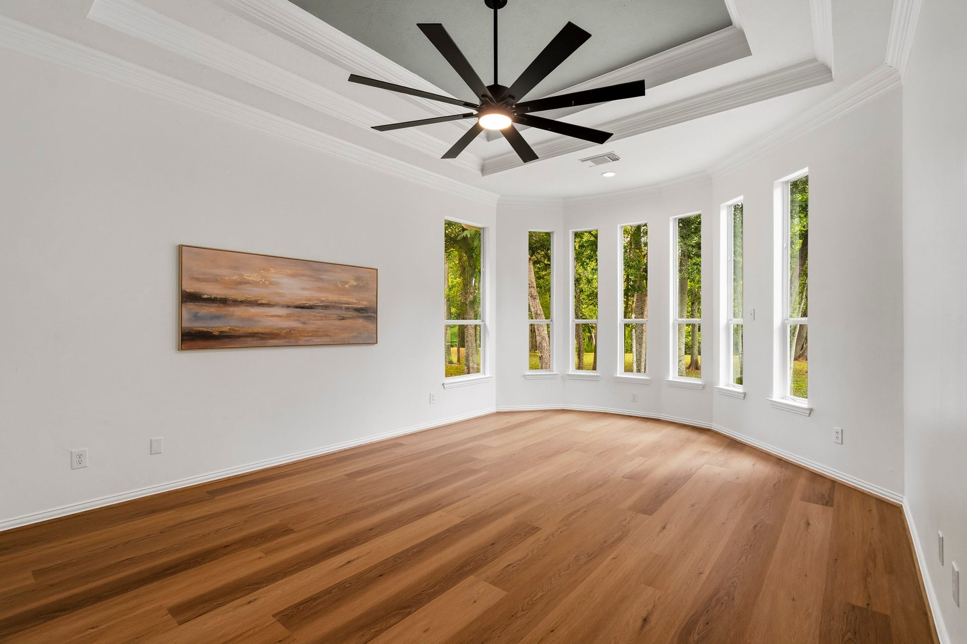 5202 Bessies Creek Trace, Fulshear, TX 77441 The spacious Primary Bedroom is a tranquil retreat, bathed in natural light from seven expansive windows that frame uninterrupted views of the lush, wooded Backyard. The abundance of windows creates an airy, serene atmosphere, allowing the beauty of the surrounding landscape to become a breathtaking backdrop to everyday living.