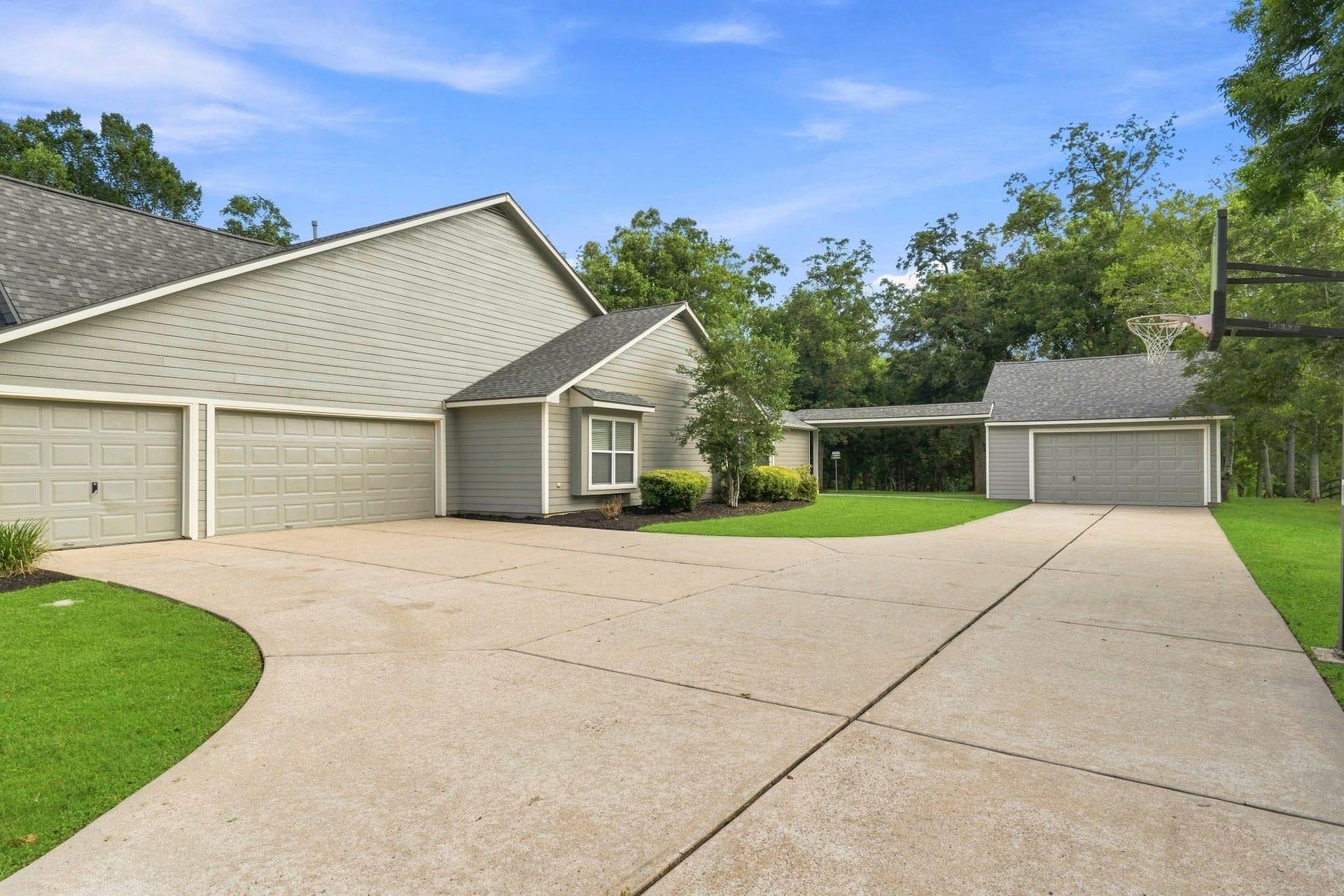 5202 Bessies Creek Trace, Fulshear, TX 77441 The oversized driveway leads to both the attached 3-car Garage and the detached, oversized 2-car Garage There is room for a basketball court too. Whether youre housing a collection of vehicles, storing a tractor, setting up a spacious workshop, or accommodating all of your recreational toys. There is even room for a basketball court!
