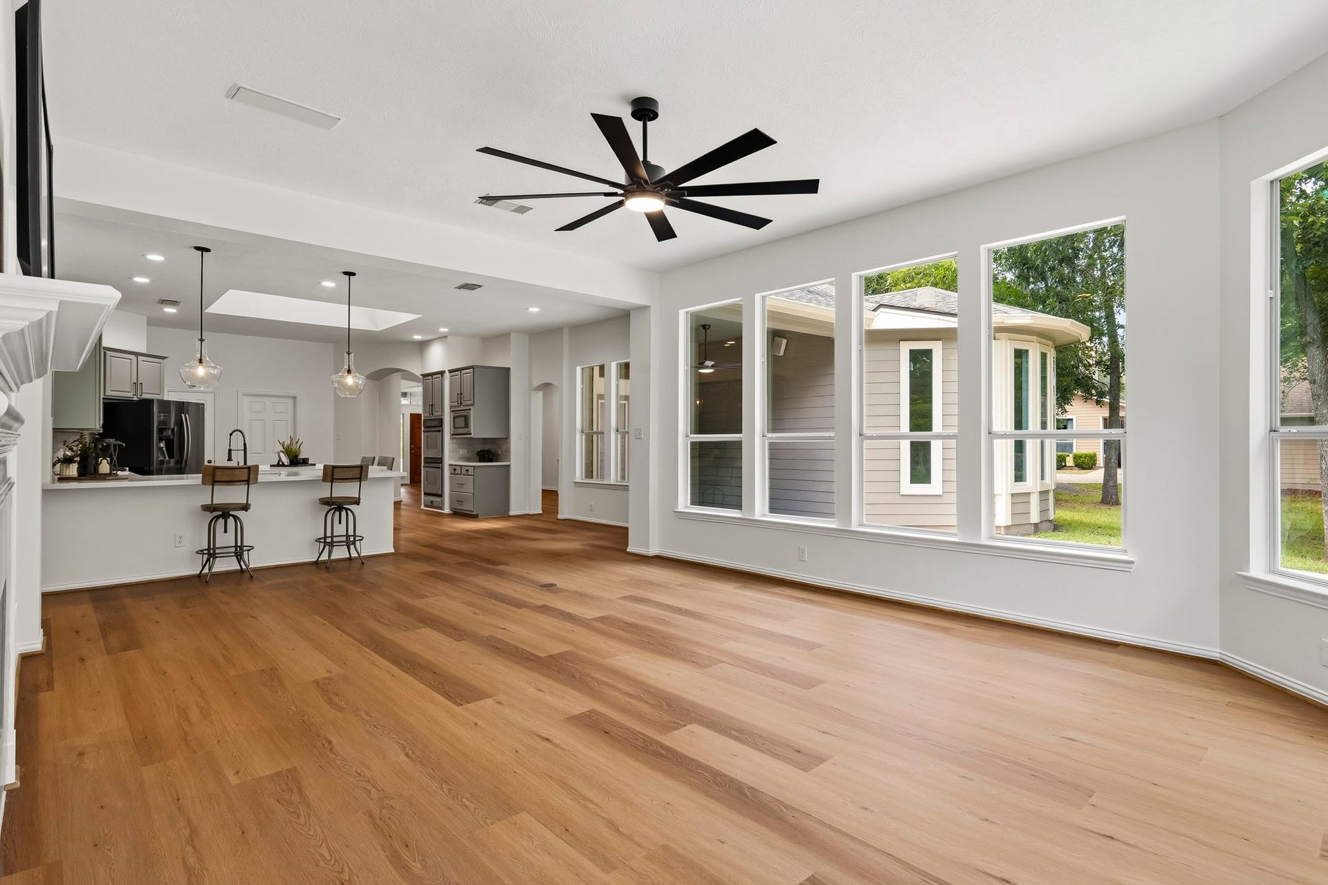 5202 Bessies Creek Trace, Fulshear, TX 77441 The Family Room enjoys open sightlines through the Kitchen, creating a seamless connection between spaces and allowing conversation to flow effortlessly throughout the heart of the home.