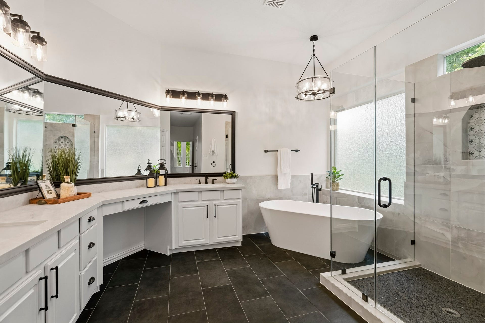 5202 Bessies Creek Trace, Fulshear, TX 77441 Showcasing a harmonious balance of classic sophistication and modern style, the Primary Bath features brand-new tile flooring that adds depth and character while providing a dramatic contrast to the bright white cabinetry and sleek quartz surfaces.