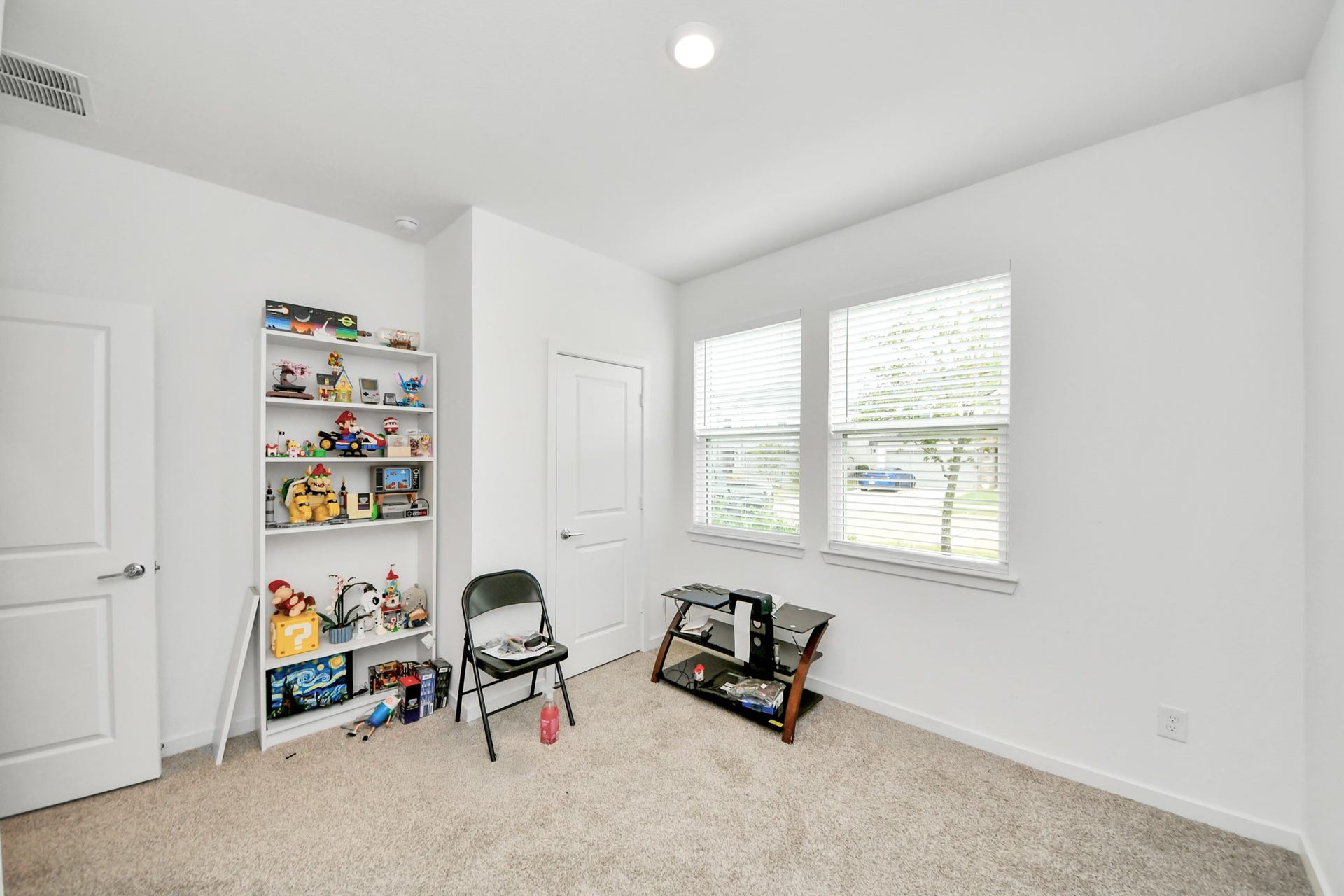 Front bedroom 3 of 4 with a lot of natural lighting.