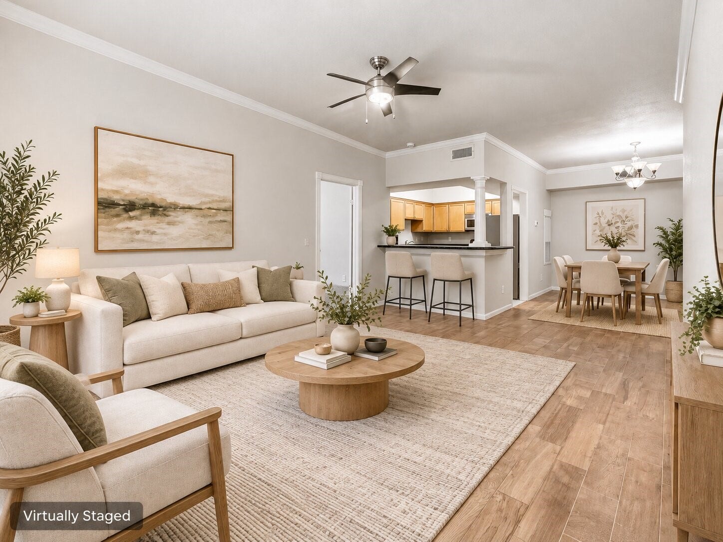 Open-concept living and dining space with easy flow to the kitchen and breakfast bar. Virtually staged to demonstrate possible furniture placement and use of the space.