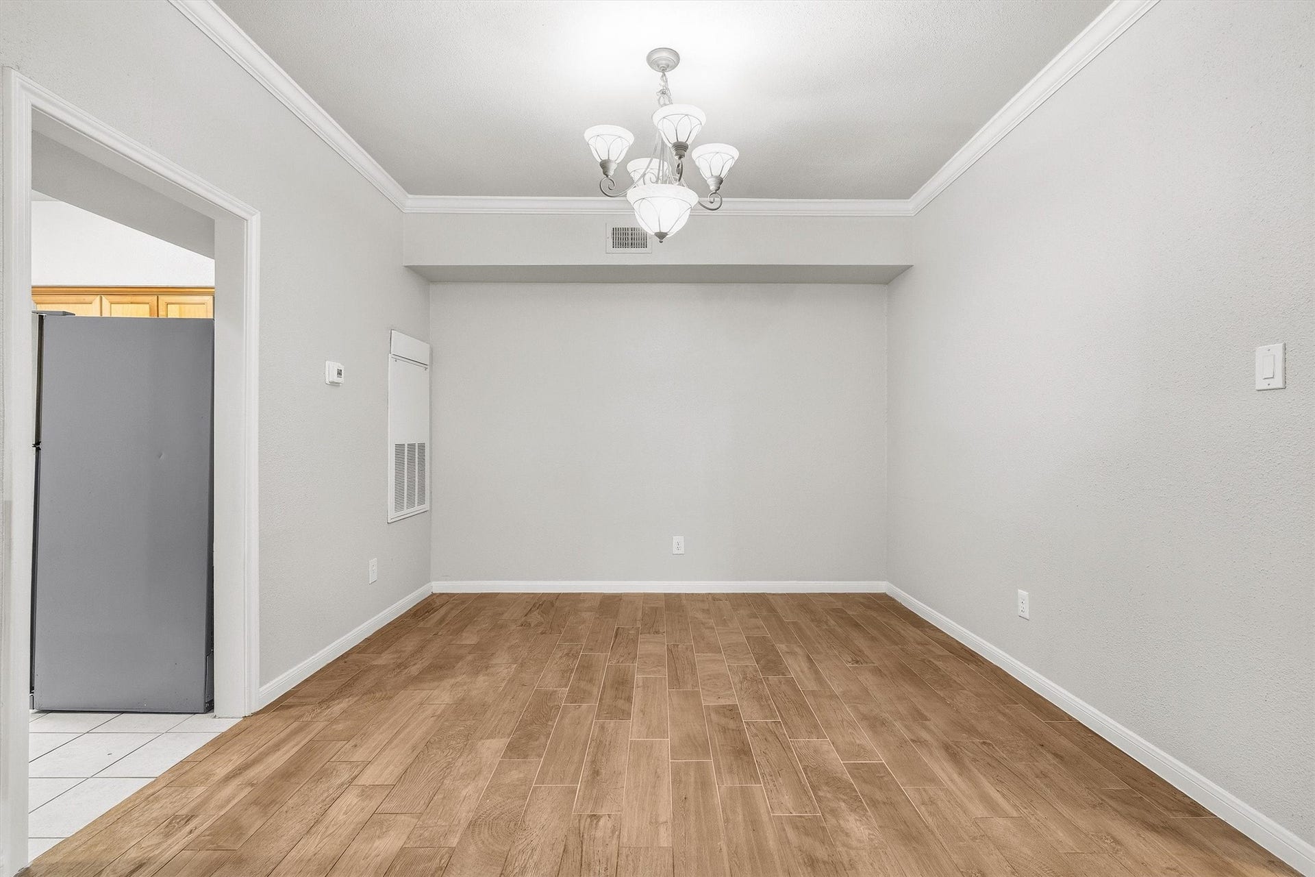 Dining space conveniently positioned between the kitchen and living room for effortless everyday living.