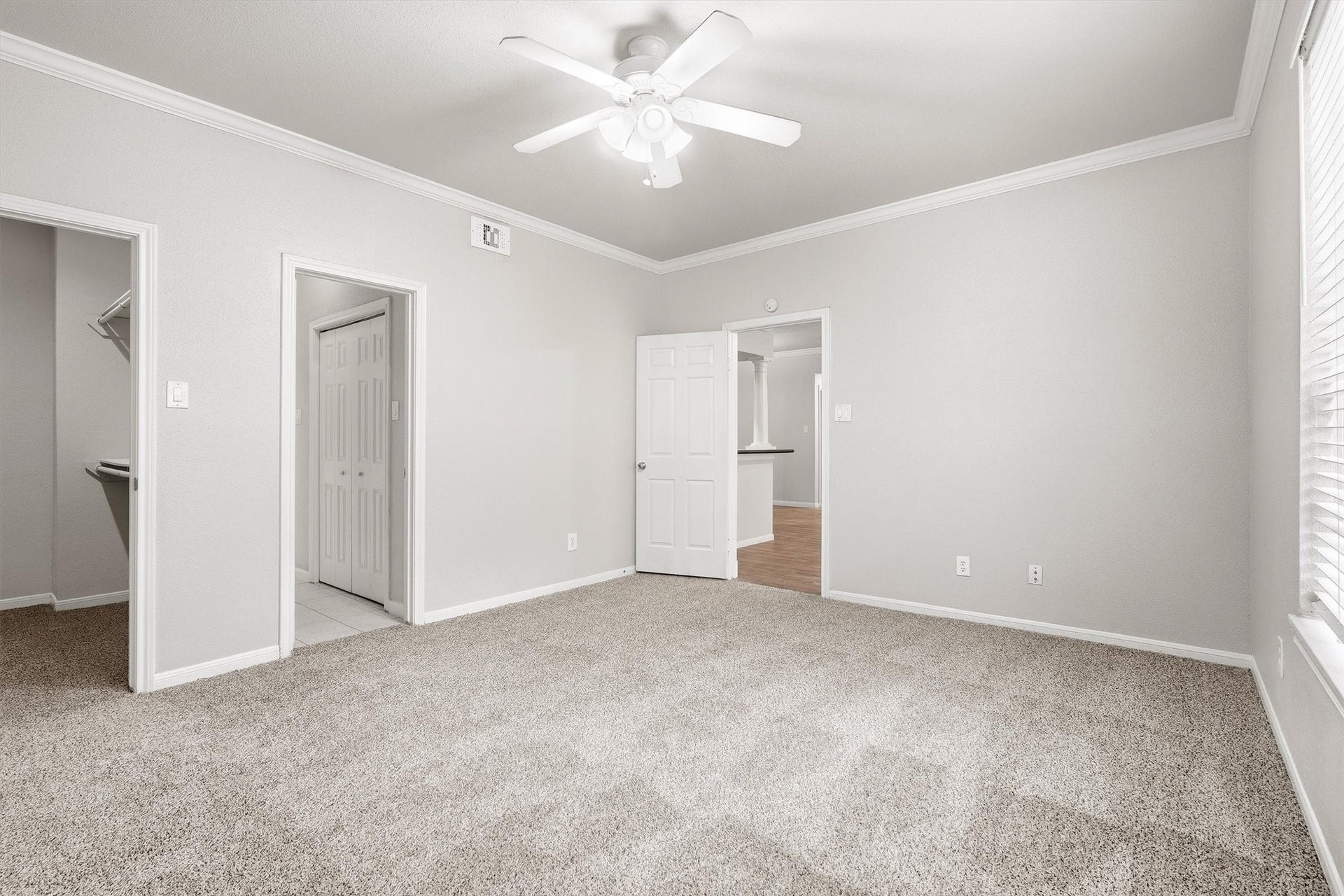 Additional view of the secondary bedroom showing closet access and a flexible layout for bedroom, office, or guest use.