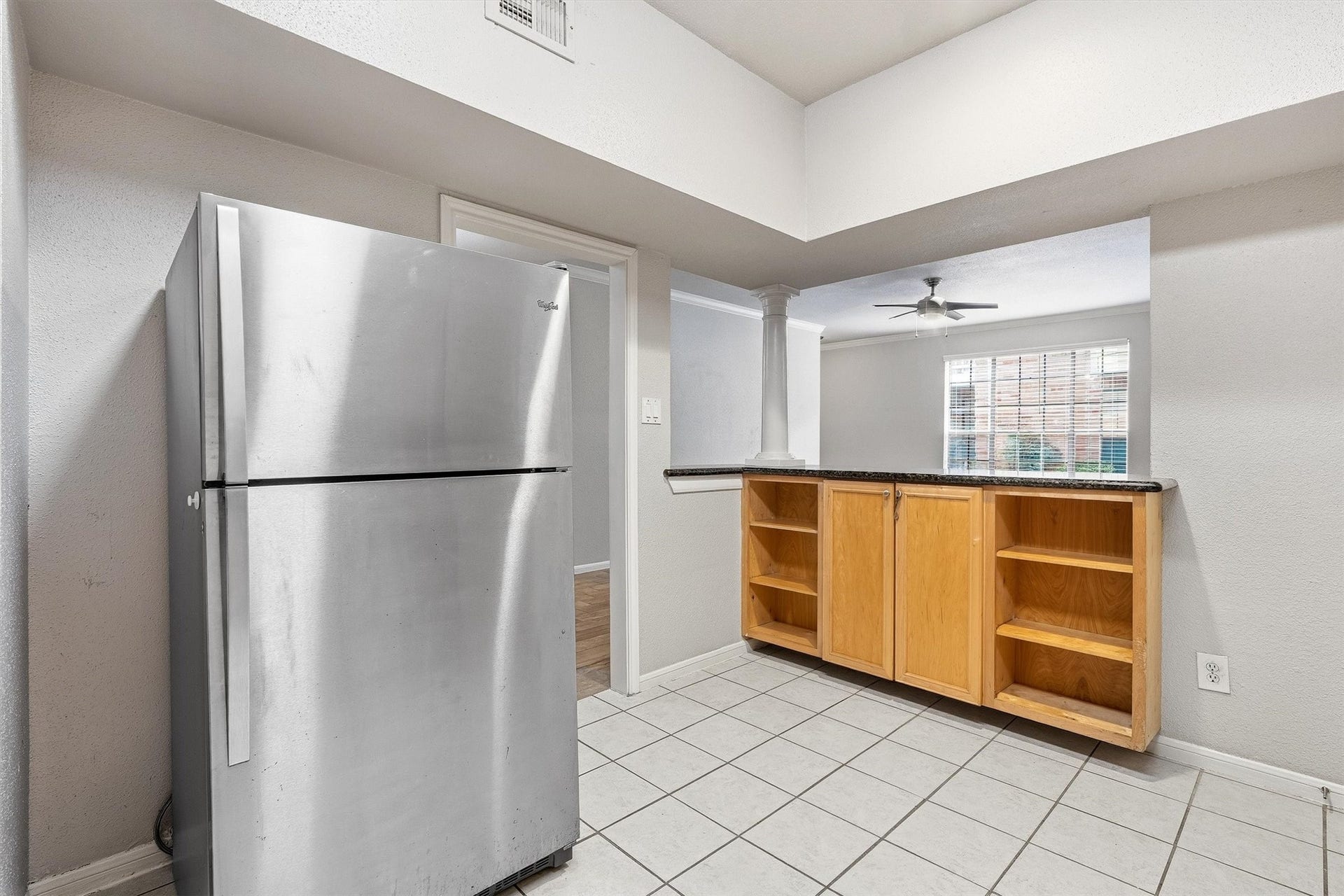 Well-planned kitchen layout with granite counters, stainless steel appliances, and ample cabinet space.