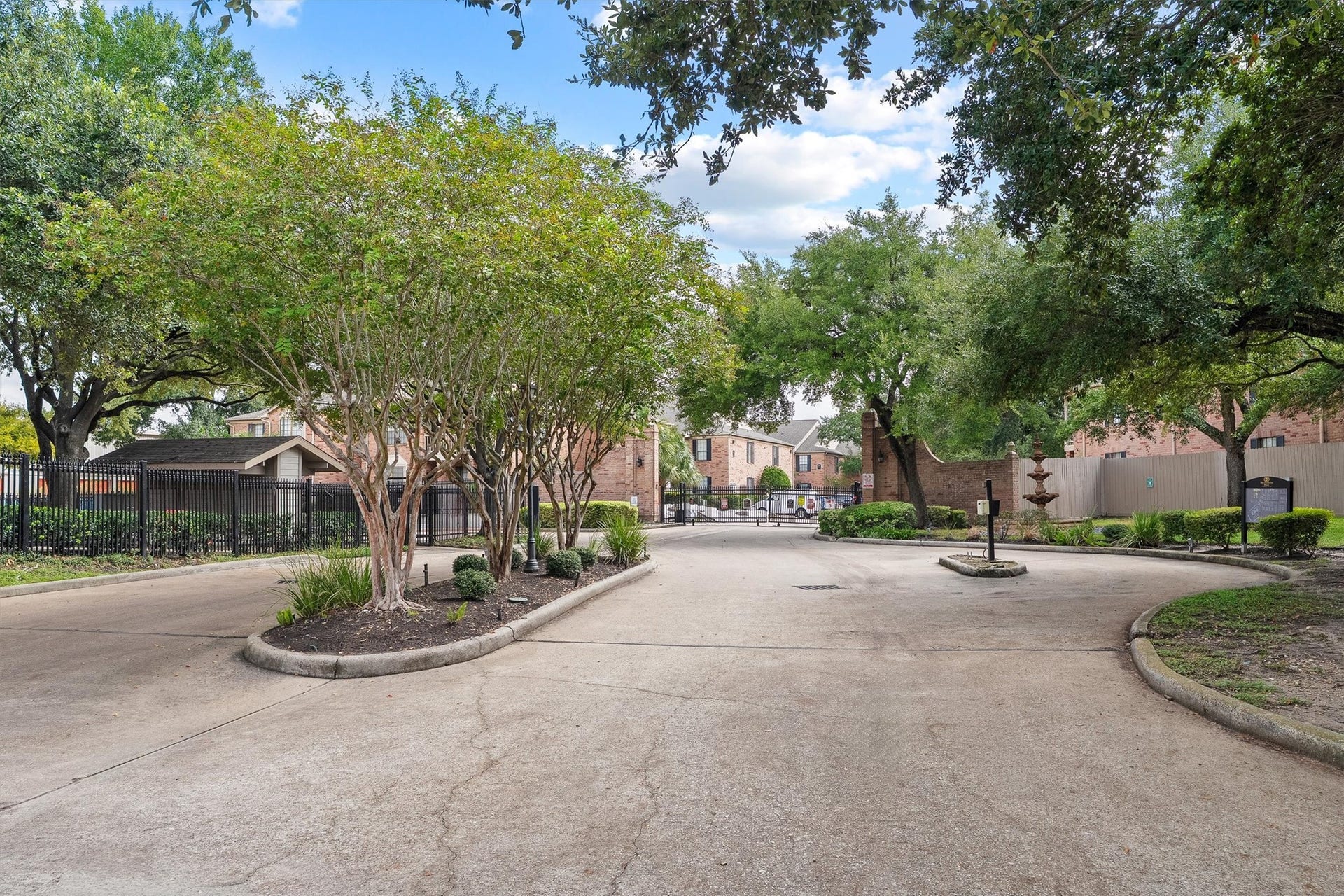Landscaped gated entrance welcomes residents and guests into the established Braeswood Park community.