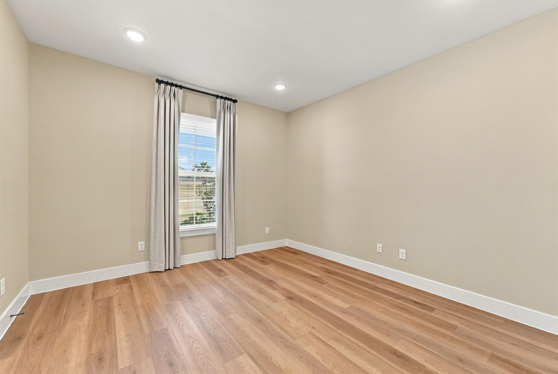 Quiet study with tailored drapery and soft natural light, ready to work as an executive home office.