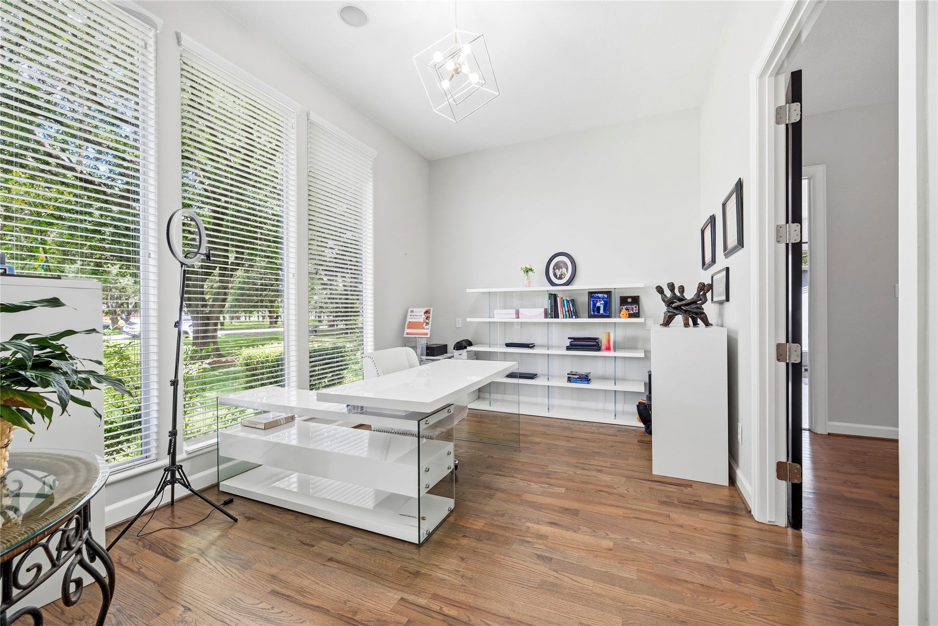23 Westpoint Drive, Missouri City, TX 77459 Private home office with oversized windows and peaceful front-yard views.