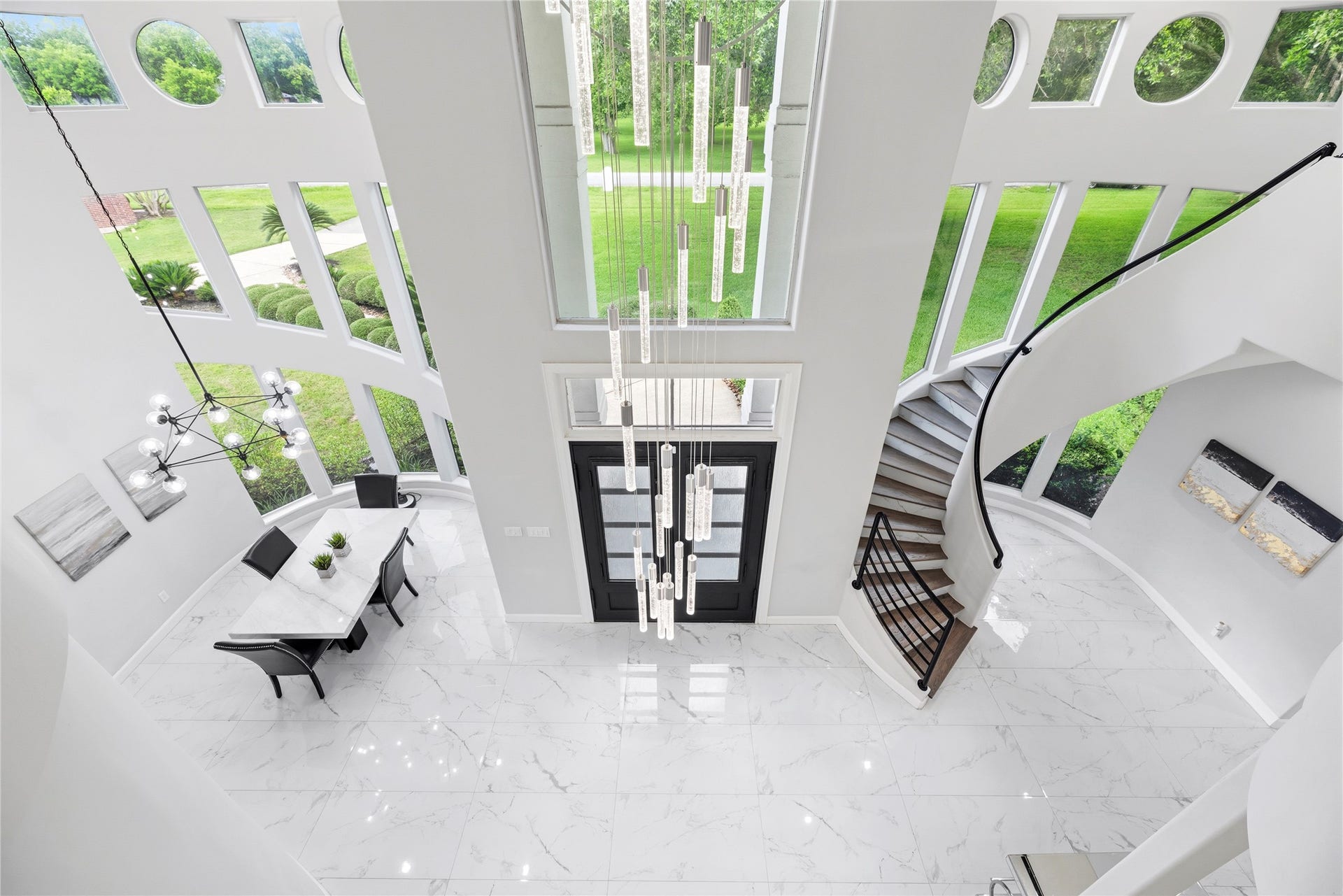 23 Westpoint Drive, Missouri City, TX 77459 Breathtaking aerial view showcasing the home's grand architecture and statement lighting.