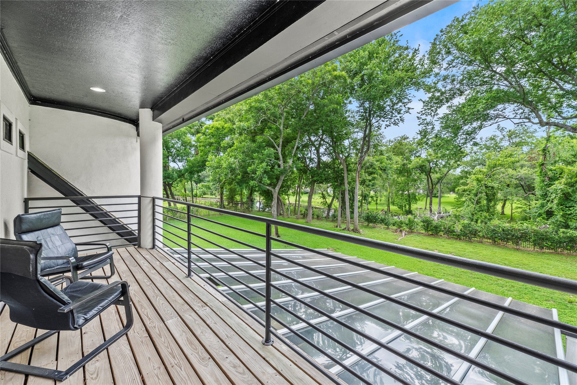 23 Westpoint Drive, Missouri City, TX 77459 Elevated balcony overlooking lush grounds, creating a peaceful setting for morning coffee or evening relaxation.