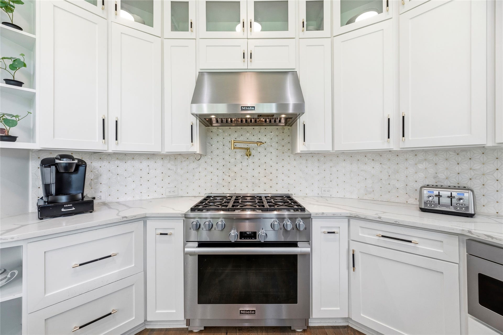 23 Westpoint Drive, Missouri City, TX 77459 Luxury culinary workspace showcasing professional-grade appliances, custom cabinetry, designer finishes, and an elegant pot filler.