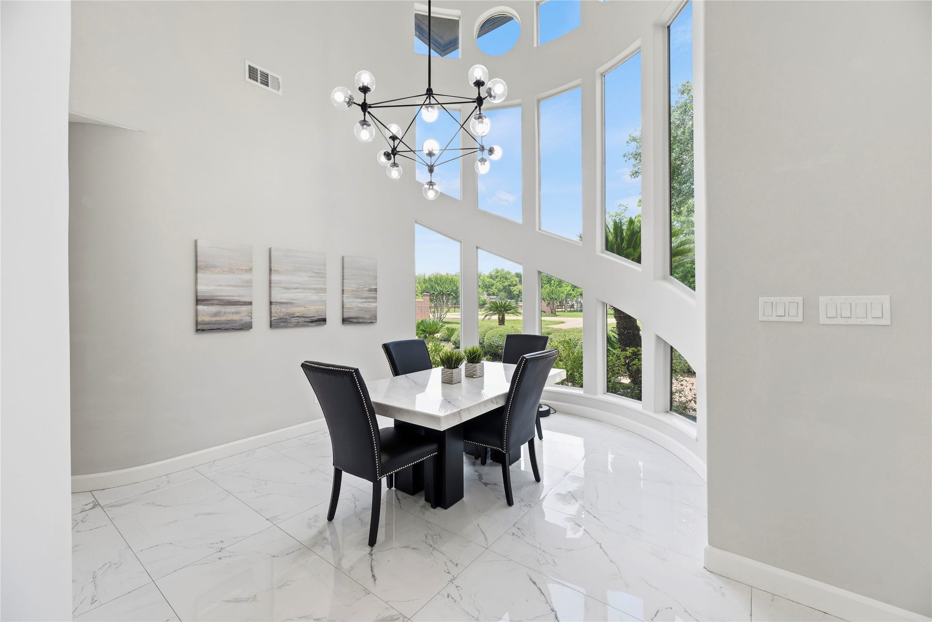 23 Westpoint Drive, Missouri City, TX 77459 Formal Dining with picturesque views, soaring ceilings, and a sophisticated staircase creating a grand first impression.