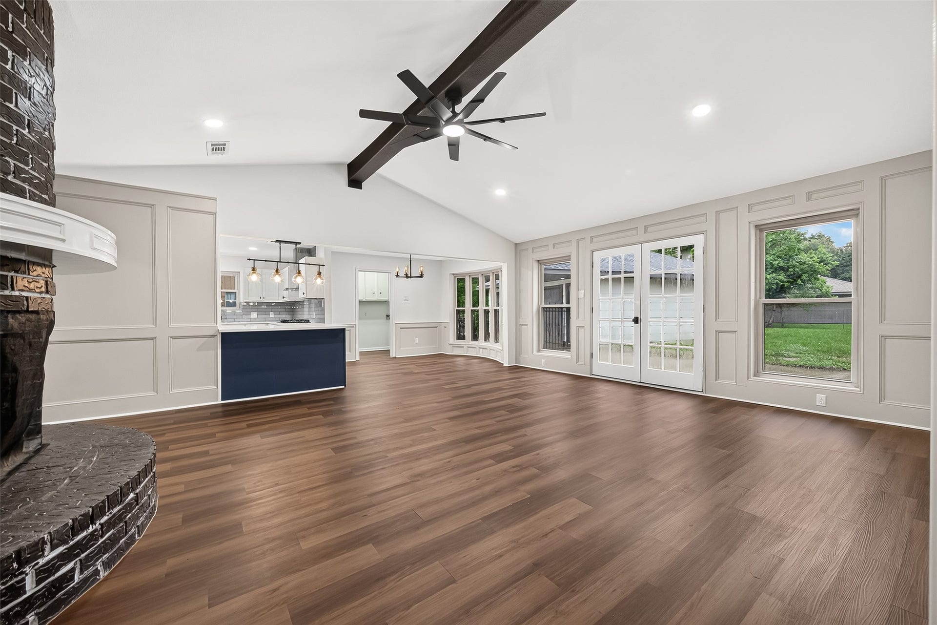 Open living area with French doors
leading to the backyard patio,
creating a seamless indoor
outdoor flow