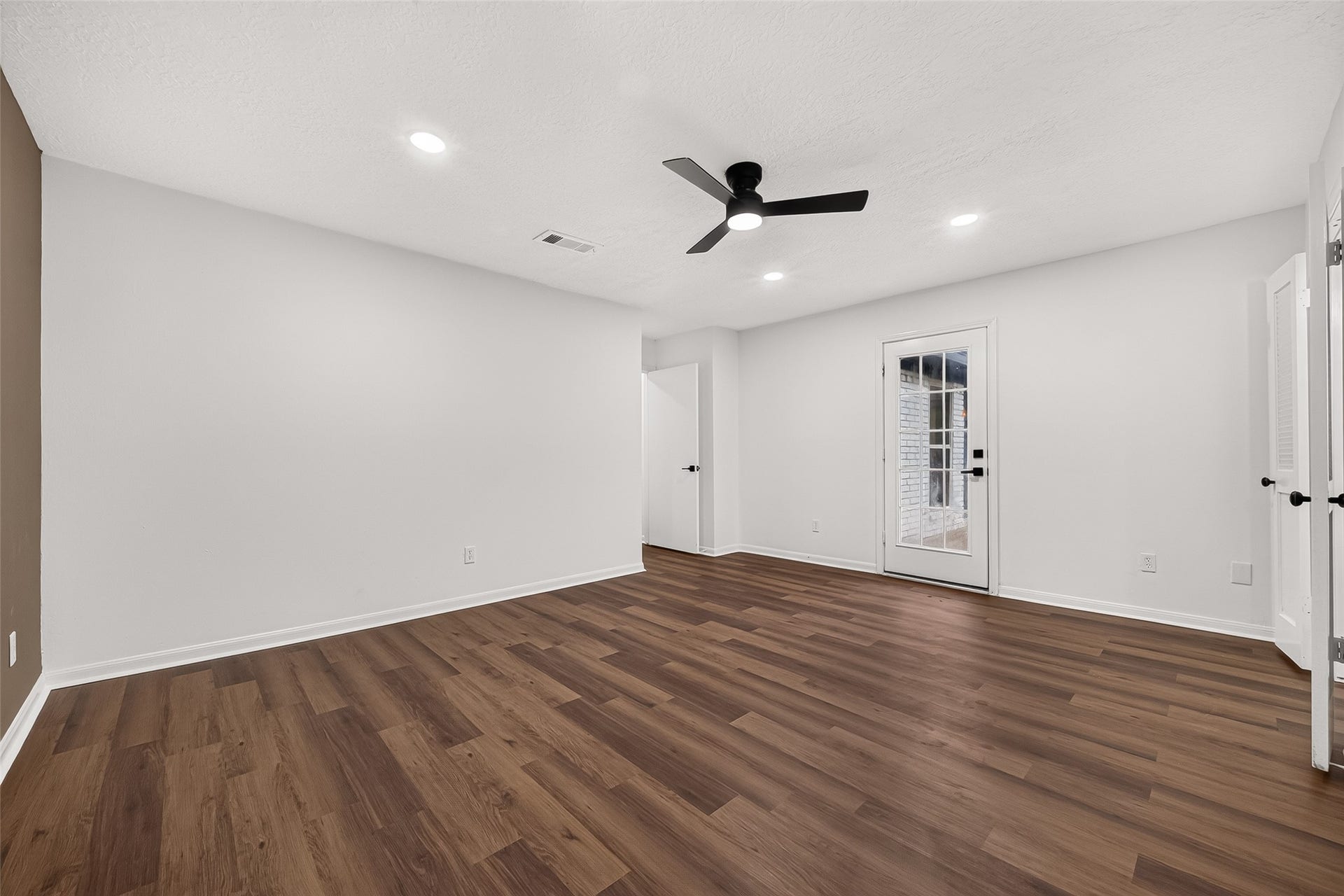 Primary bedroom offers convenient
access to the backyard through a
private exterior door