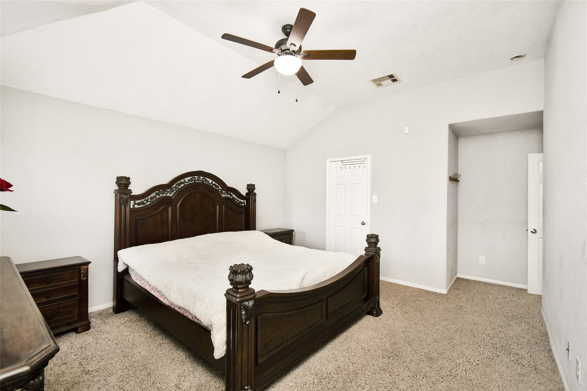 2319 Blue Reef Drive, Katy, TX 77449 Generously sized primary suite with soft carpet flooring and a walk-in closet nook.