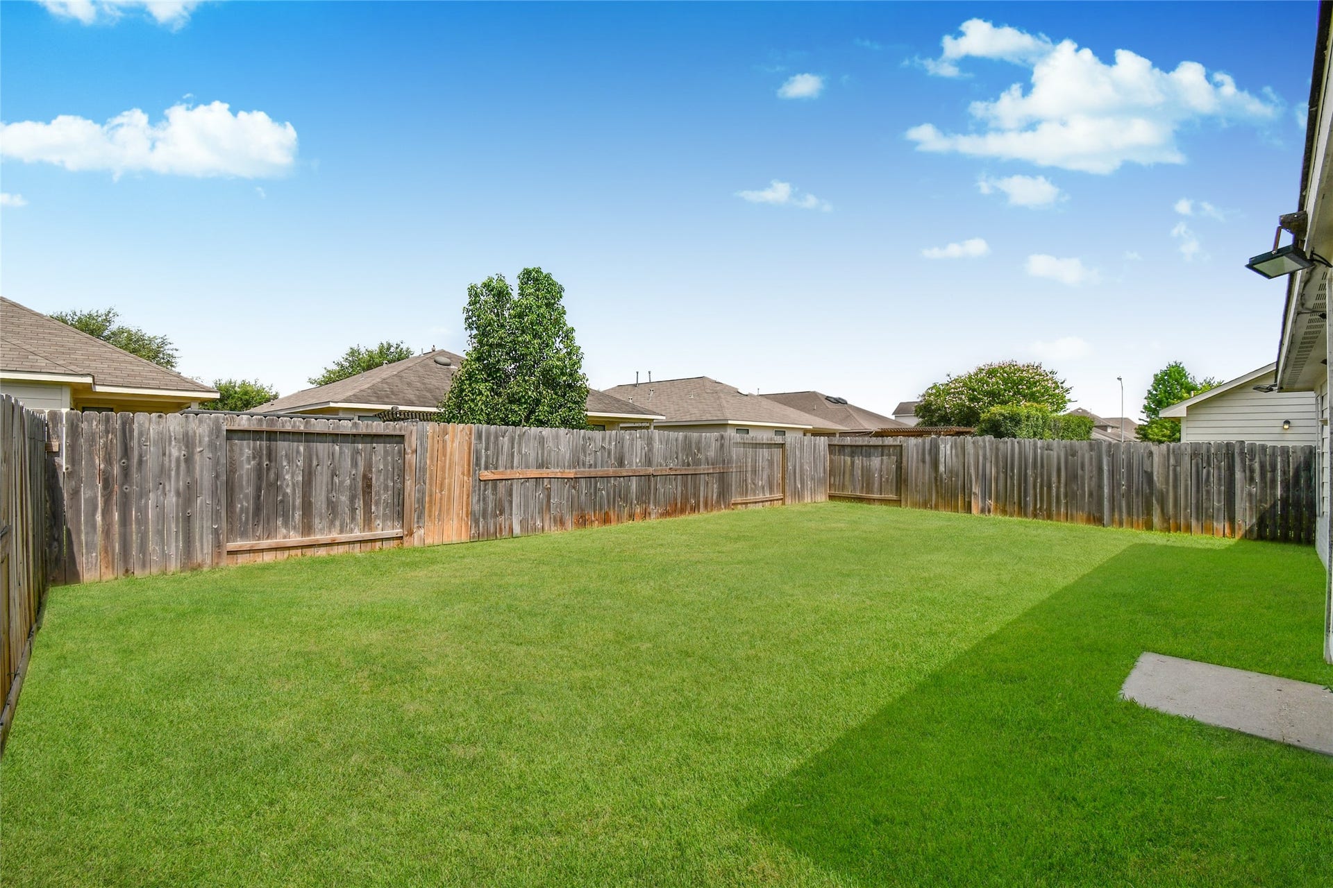 2319 Blue Reef Drive, Katy, TX 77449 Spacious fenced backyard offering plenty of room to relax, entertain, or add your personal touch