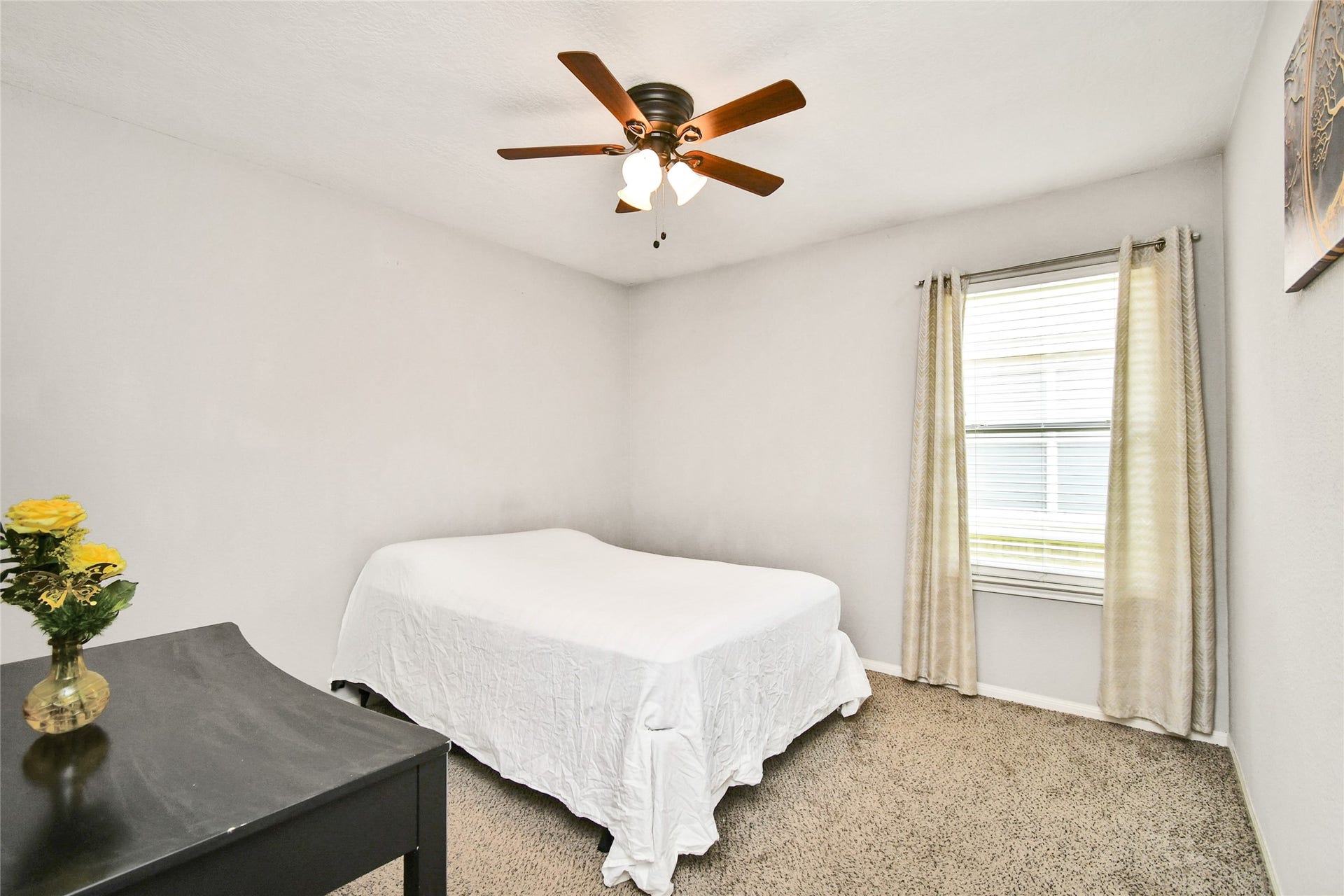 2319 Blue Reef Drive, Katy, TX 77449 Inviting bedroom with large window, natural light, and plush carpet flooring.