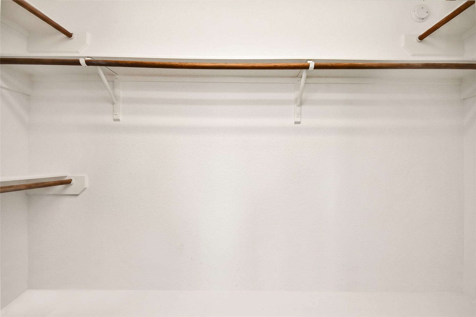 2319 Blue Reef Drive, Katy, TX 77449 Spacious walk-in closet with double hanging rods, ready to fit a wardrobe of any size.
