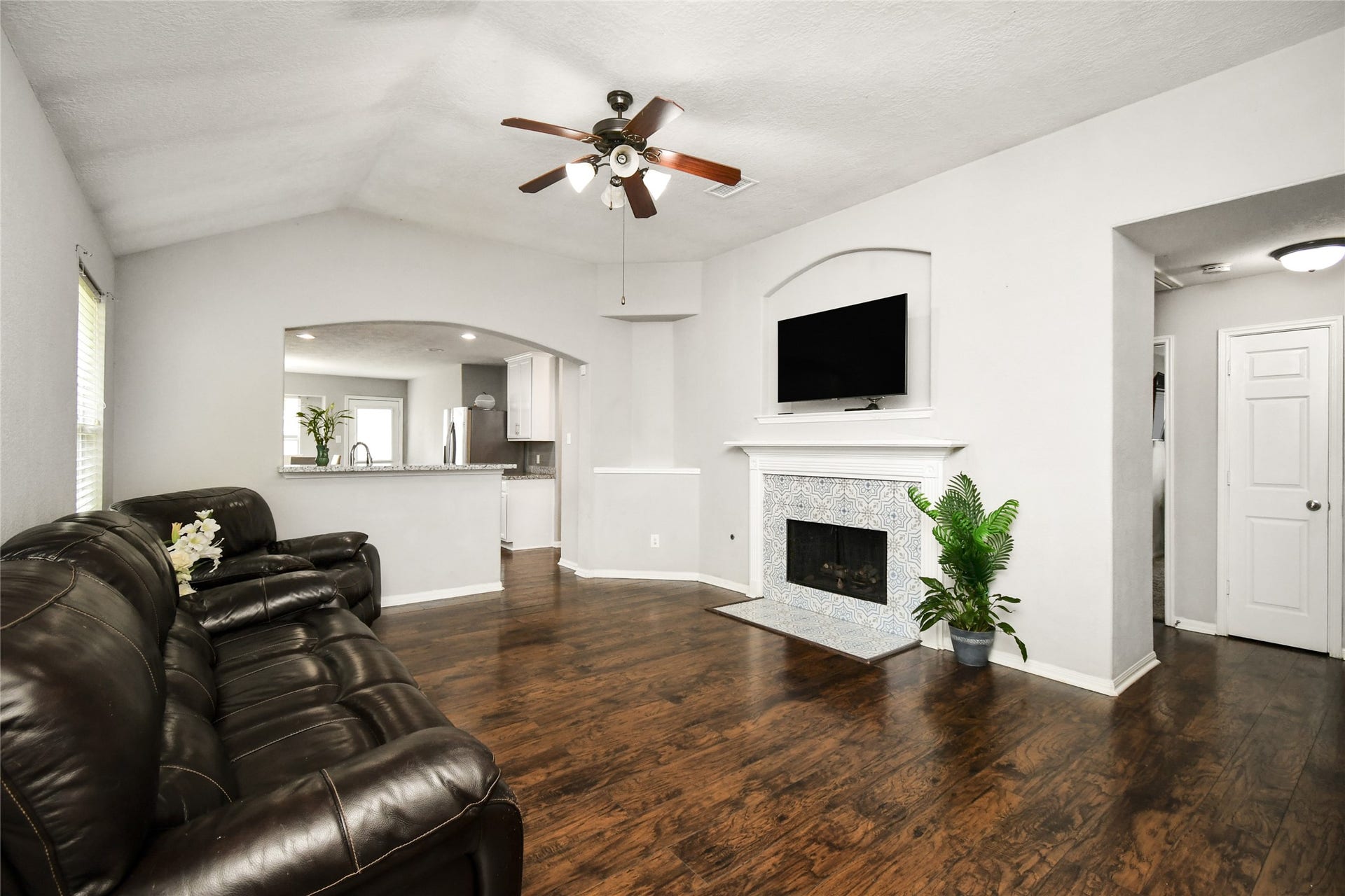 2319 Blue Reef Drive, Katy, TX 77449 Spacious living room featuring a tile surround fireplace