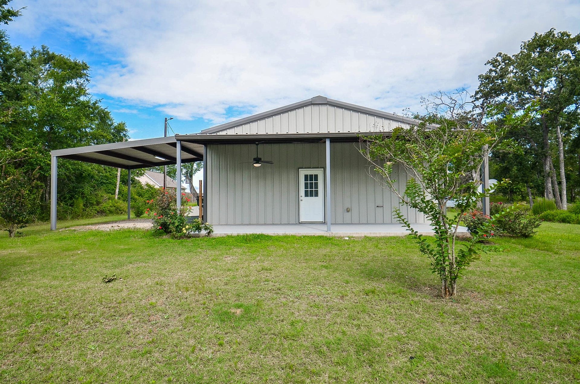 Here's an open, refreshing view of the rear of the home, with ample covered patio.