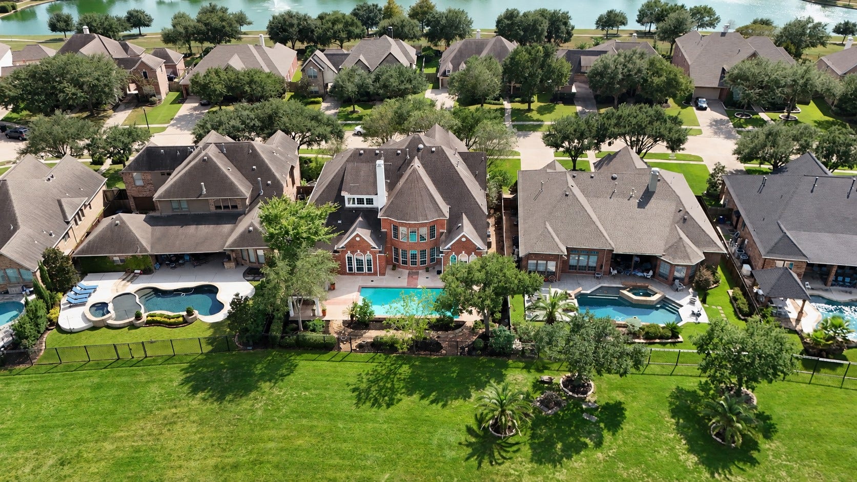 12103 Cypress Creek Lakes Drive, Cypress, TX 77433 Gorgeous pool overlooking the lake.