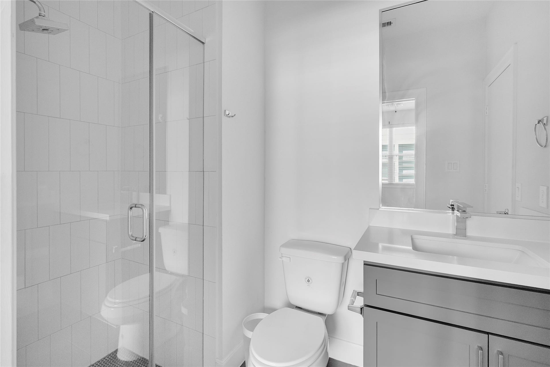 The first-floor bedroom has a private walking shower.