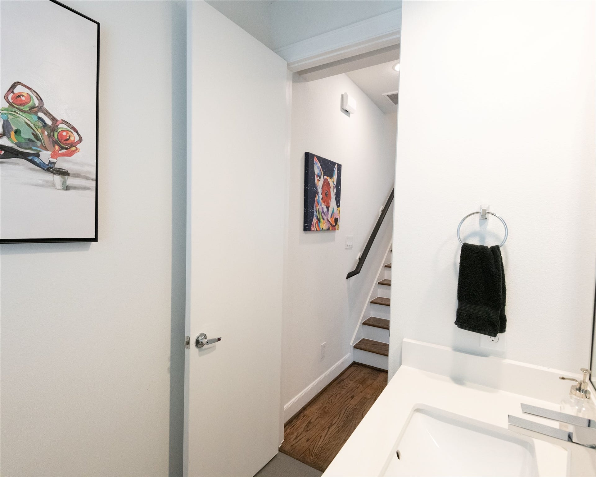 ** Picture of home previously furnished -- Guest half Bathroom leading to the third floor.