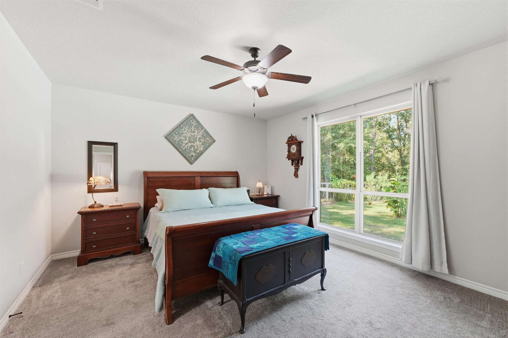 Large primary bedroom is very spacious and great views of the backyard.