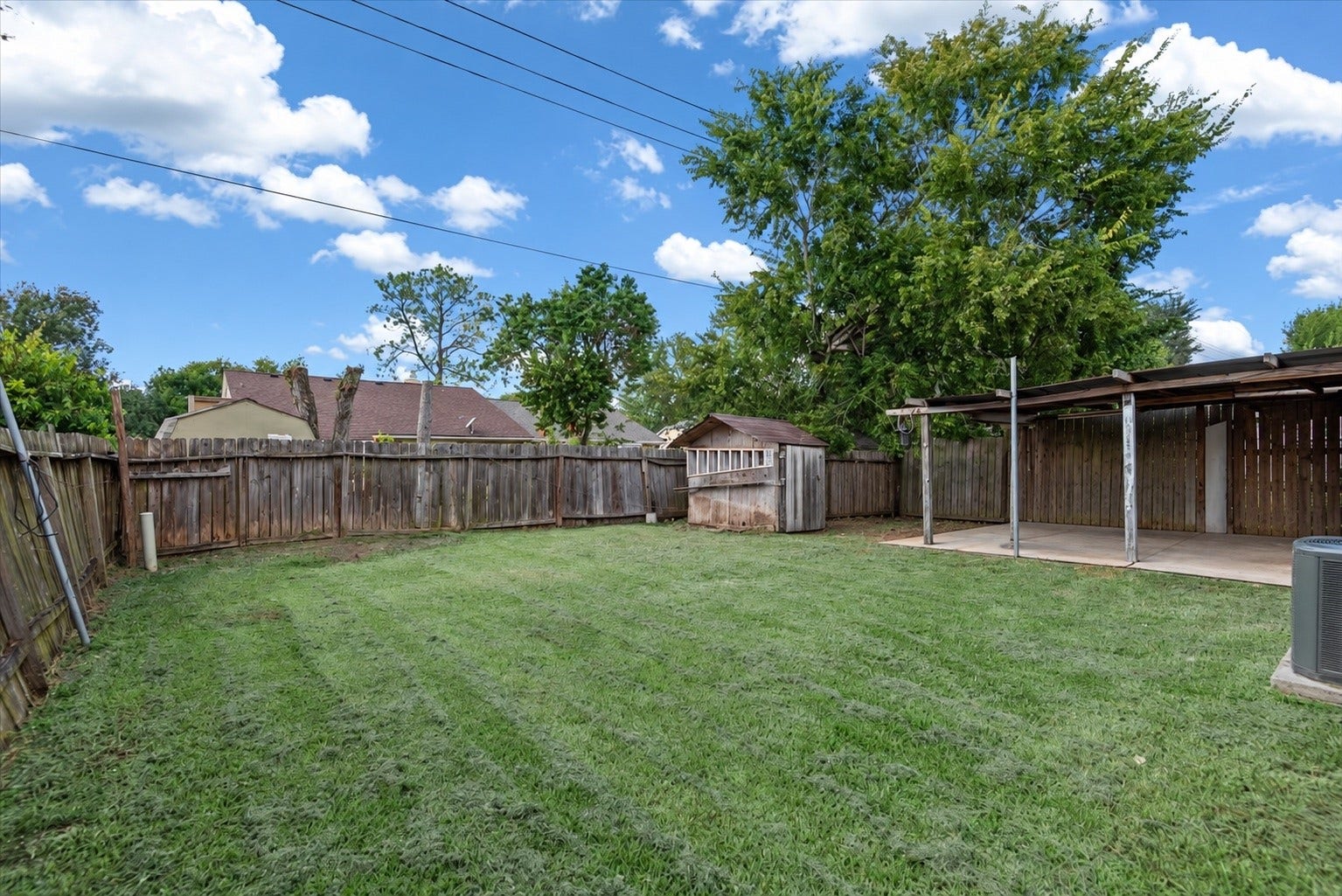 9522 Wellsworth Drive, Houston, TX 77083 Private, wide-open yard surrounded by mature trees