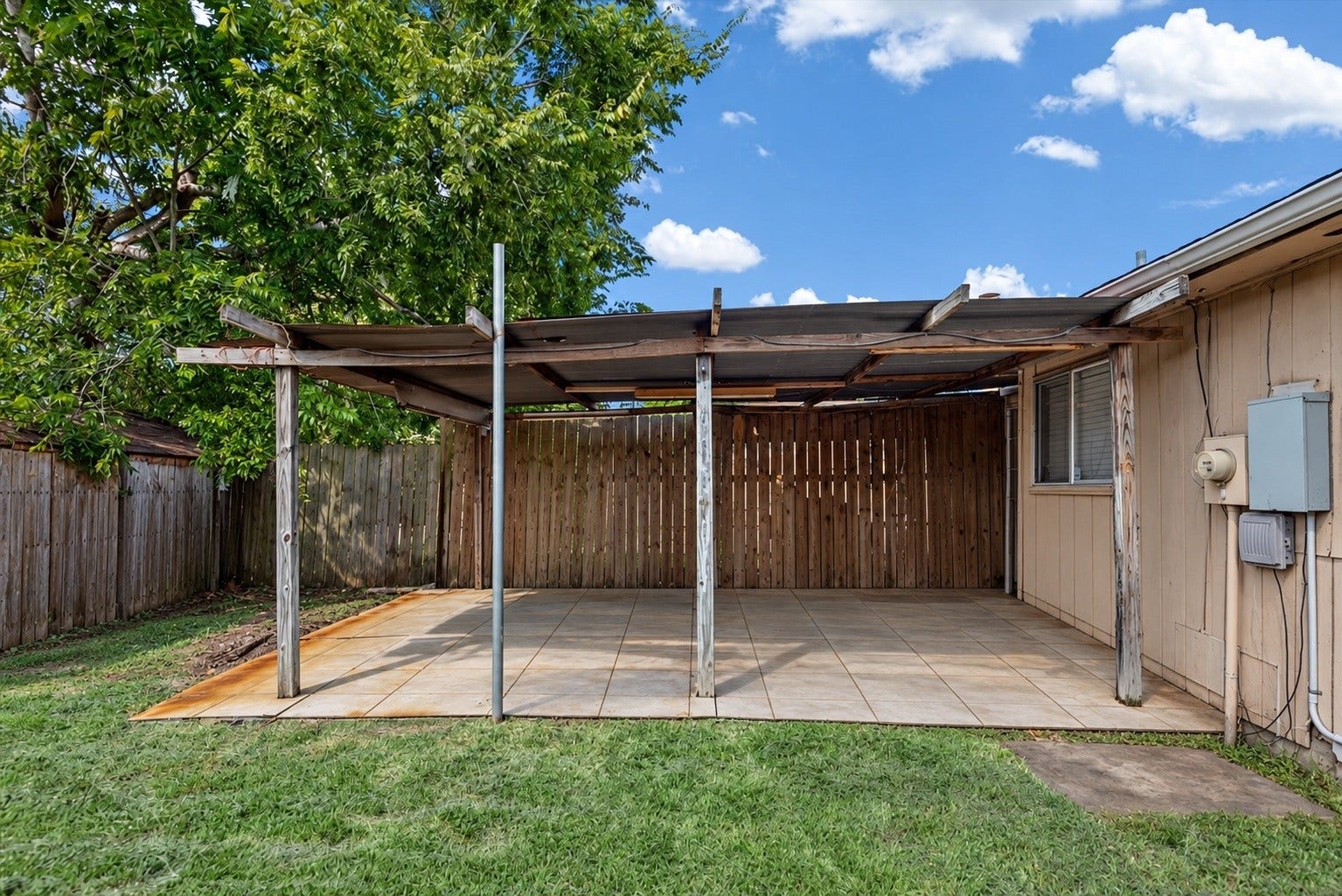 9522 Wellsworth Drive, Houston, TX 77083 Covered patio ready for weekend barbecues and shaded relaxation