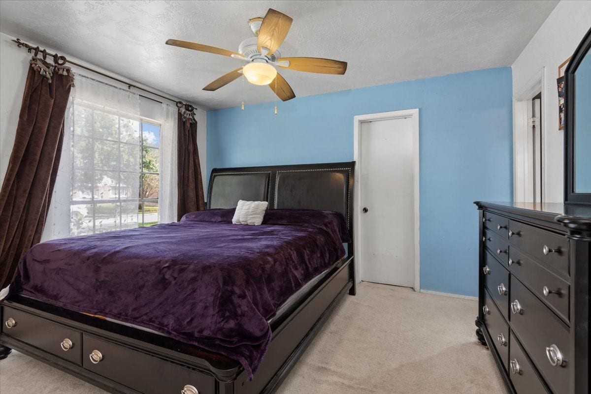 9522 Wellsworth Drive, Houston, TX 77083 Spacious primary bedroom with walk-in closet and ample natural light.