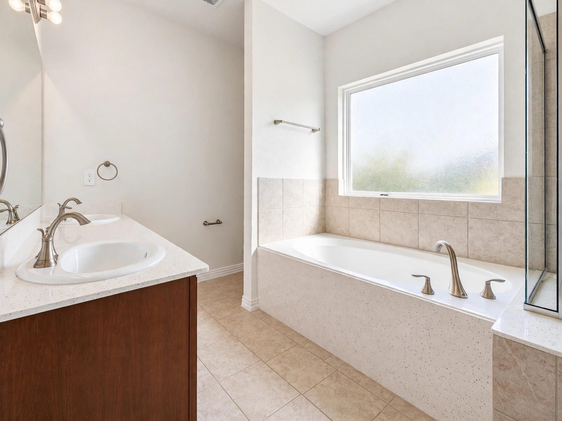 1902 Willow Ridge Ln, Fulshear, TX 77423 Another view of the bathroom showcases the vanity, soaking tub, and natural light.