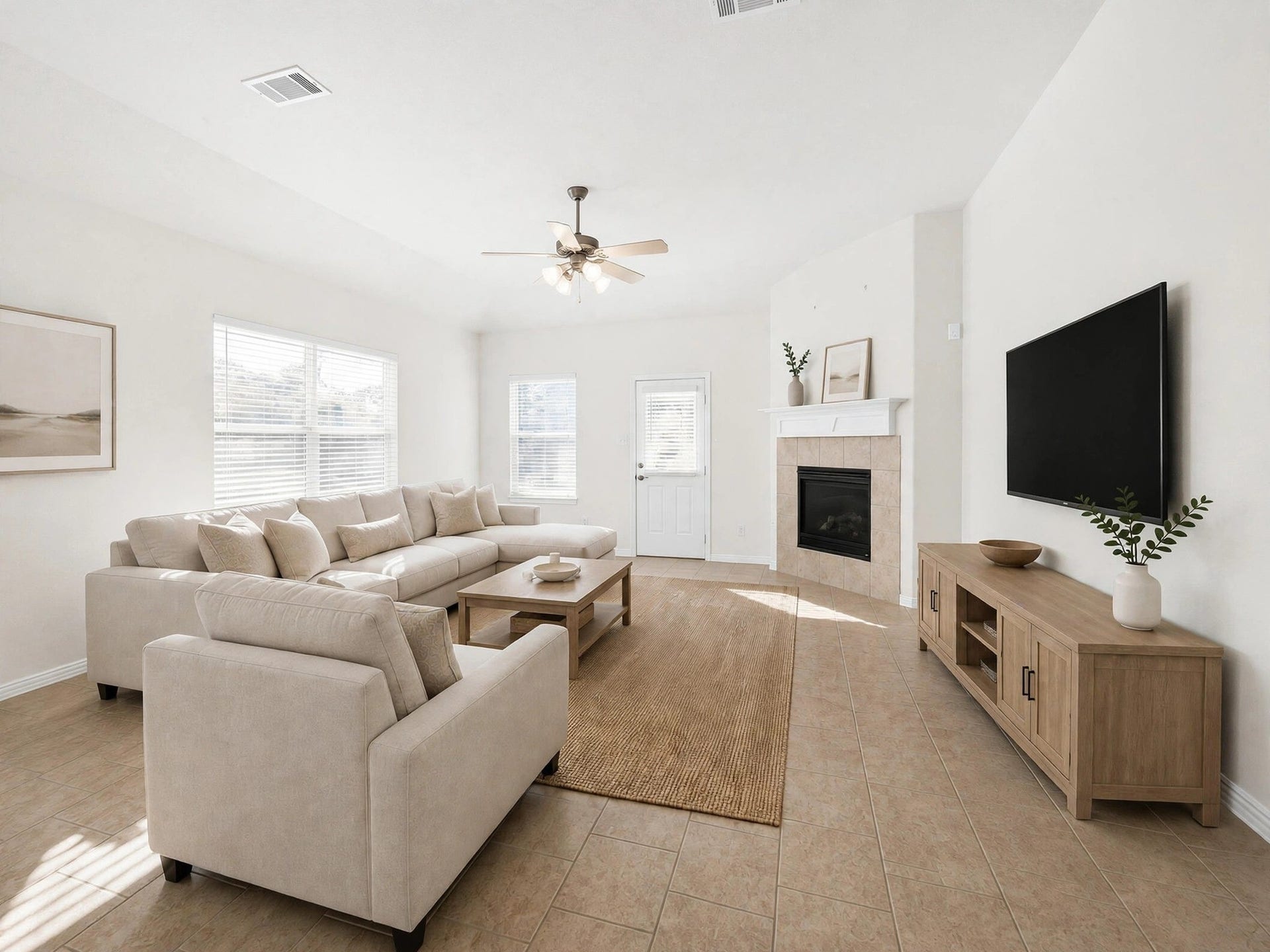 1902 Willow Ridge Ln, Fulshear, TX 77423 Furnished living room view highlights the fireplace, natural light, and space for gathering and relaxing. (Virtually staged)