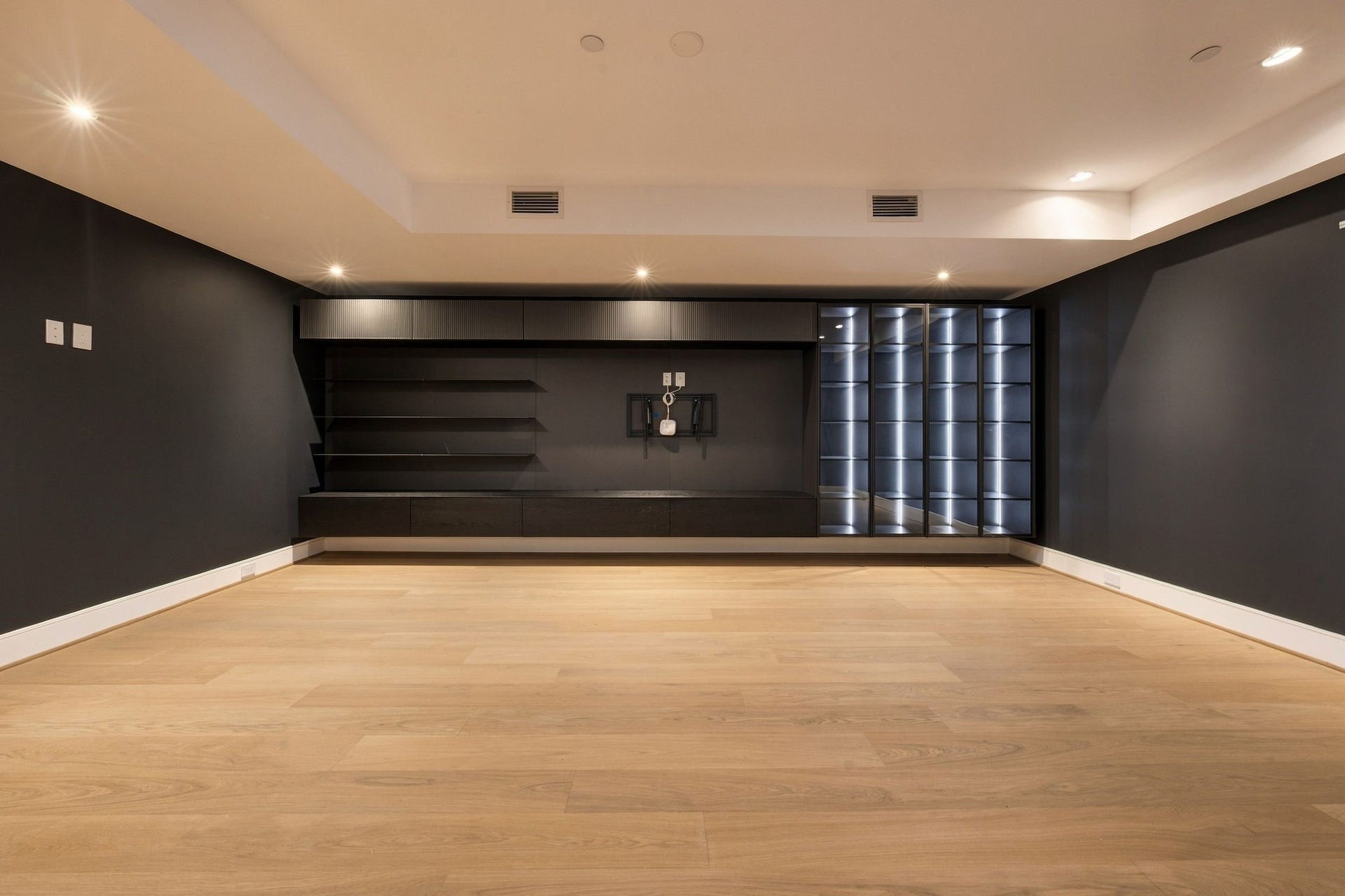 Large, moody media room upstairs.