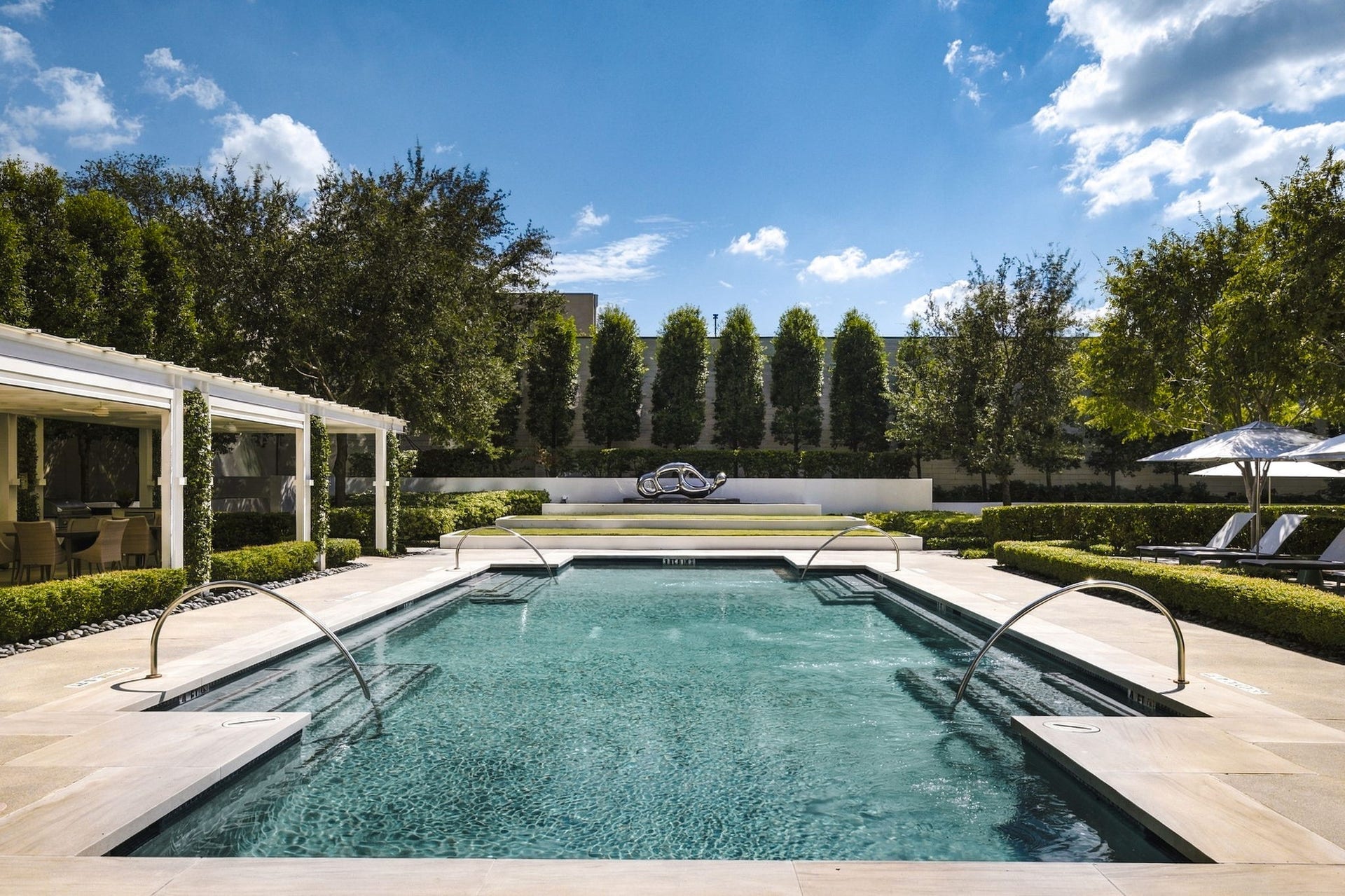Large lap pool, and lush gardens with private seating areas.