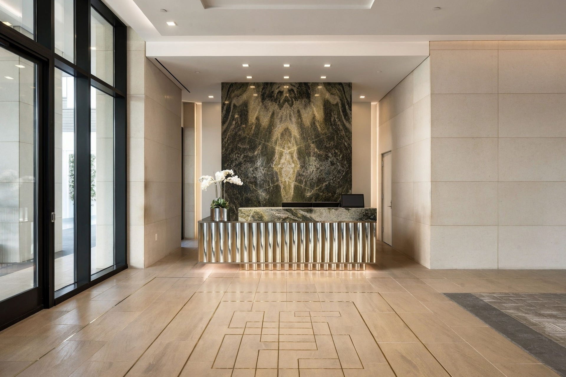 Gracious building entry and concierge desk.