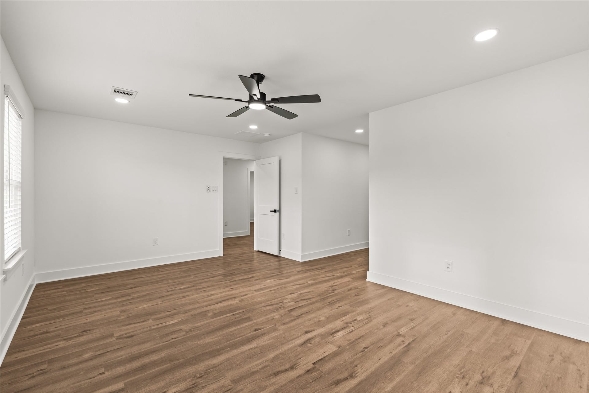 4702 Rawley Street, Houston, TX 77020 Versatility at its finest. This bright secondary bedroom offers the perfect layout for a premium home office, a creative studio, or a guest suite.